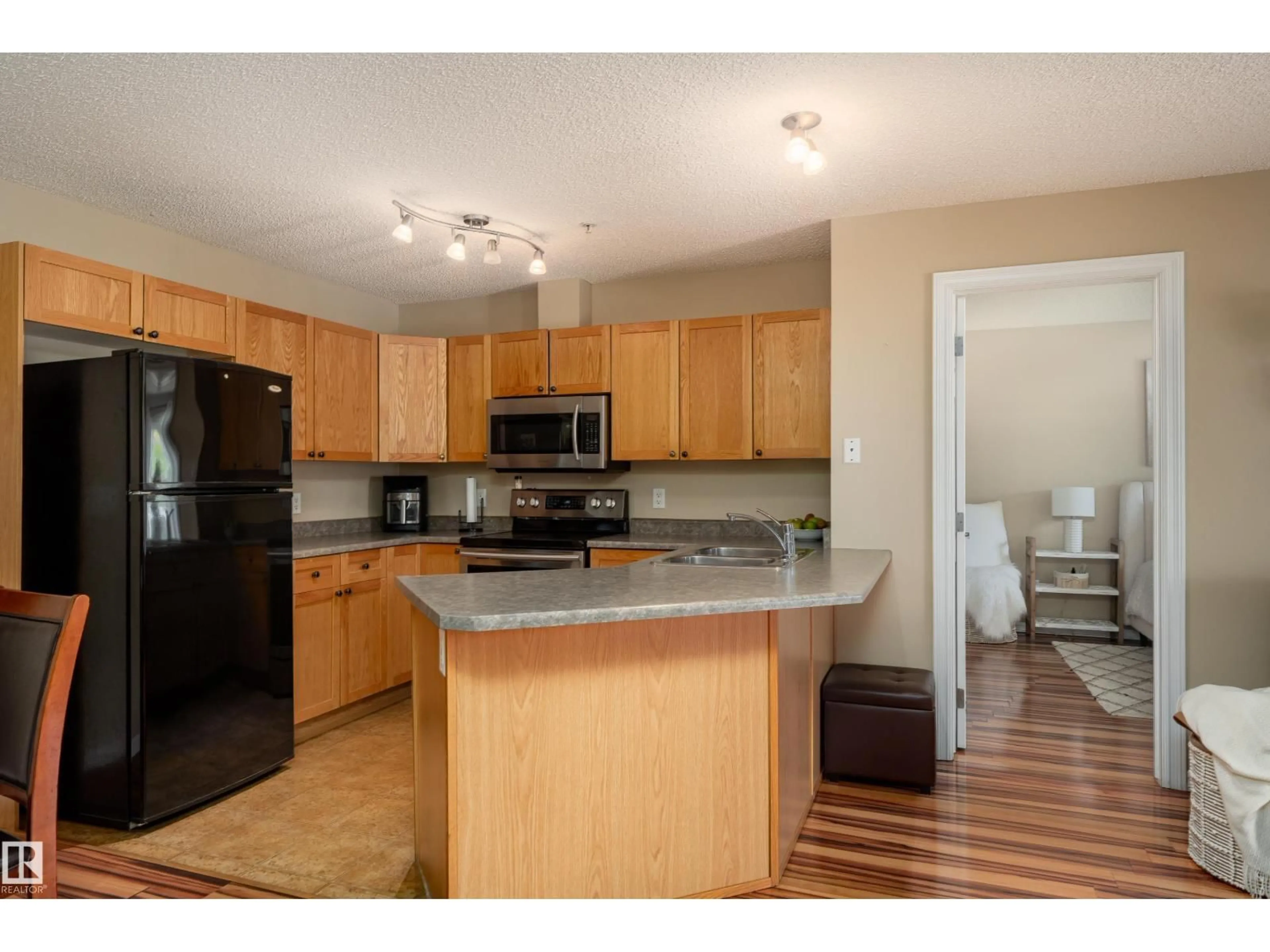 Open concept kitchen, unknown for #103 - 13710 150 AV, Edmonton Alberta T6V0B2