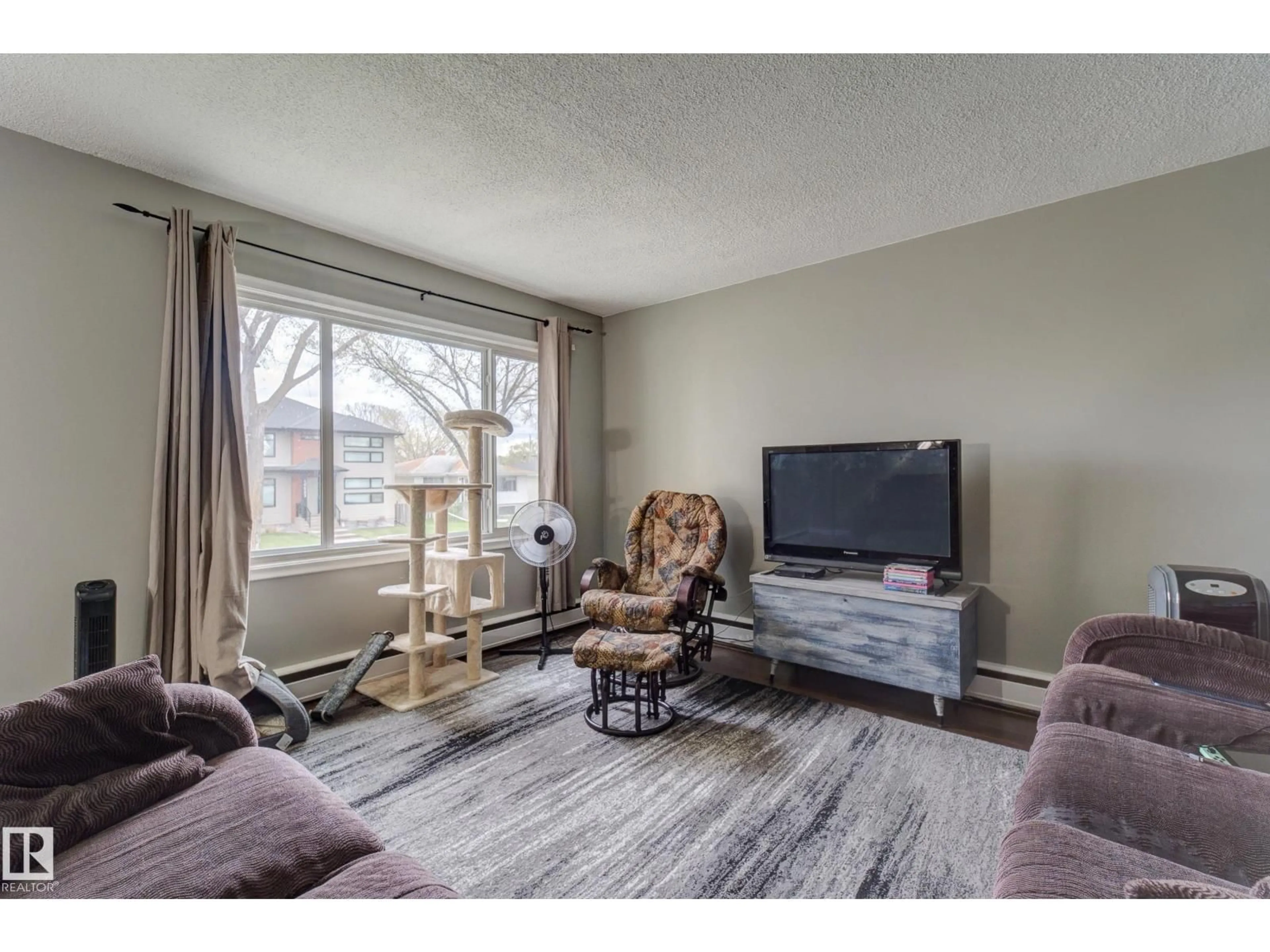 Living room with furniture, unknown for 10524 78 ST, Edmonton Alberta T6A3E9