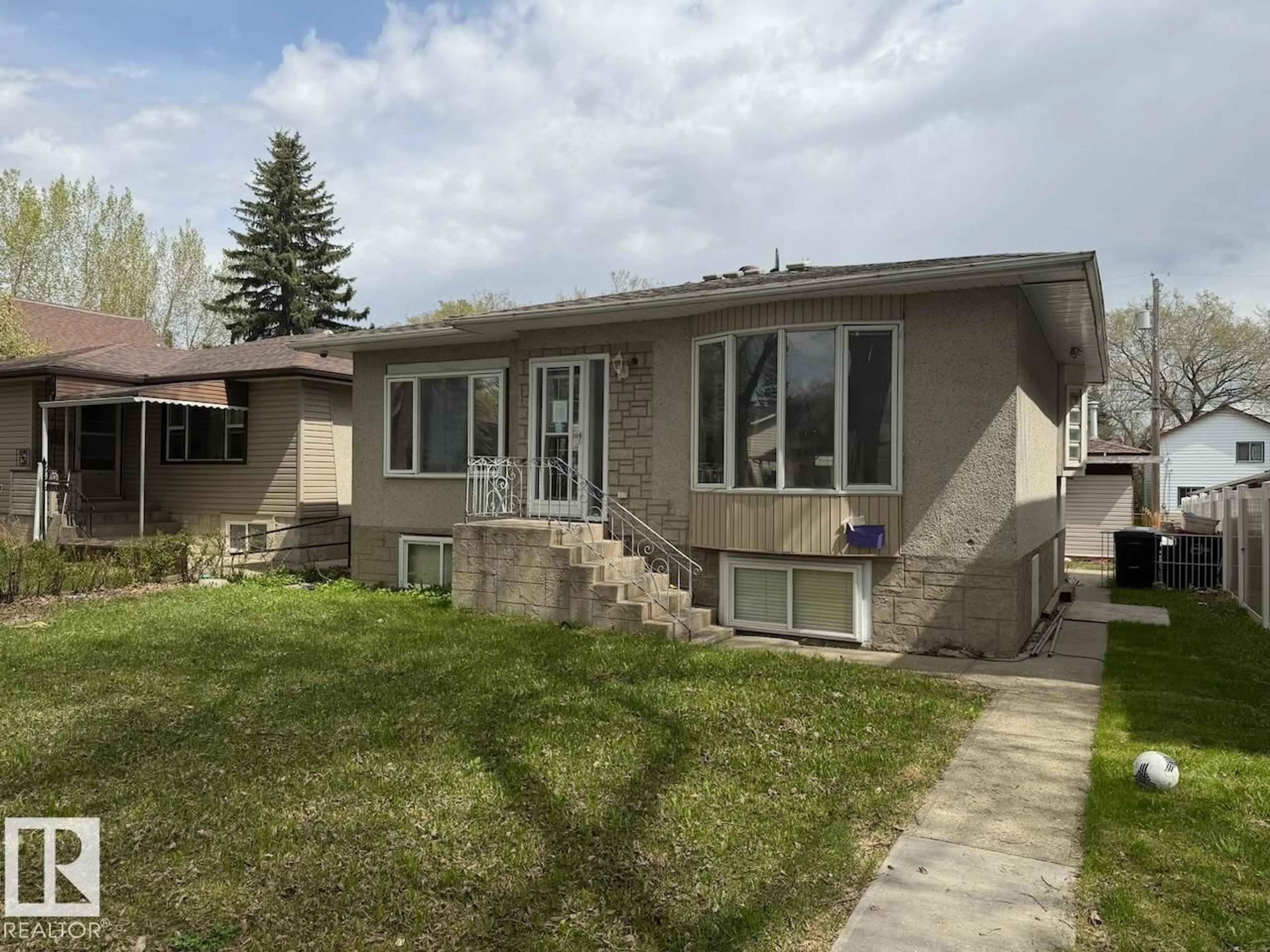 Home with vinyl exterior material, street for NW - 11839 56 ST, Edmonton Alberta T5W3S7