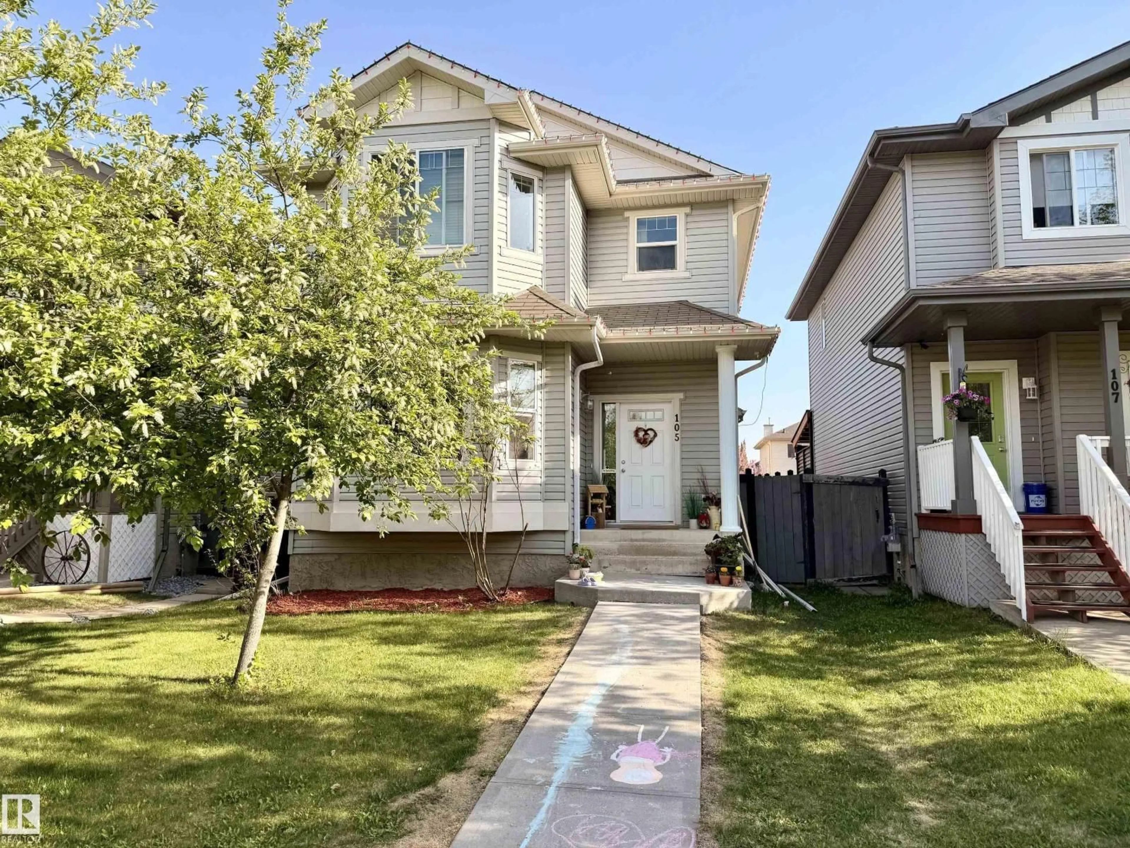 Home with vinyl exterior material, street for 105 KEYSTONE CR, Leduc Alberta T9E0J4