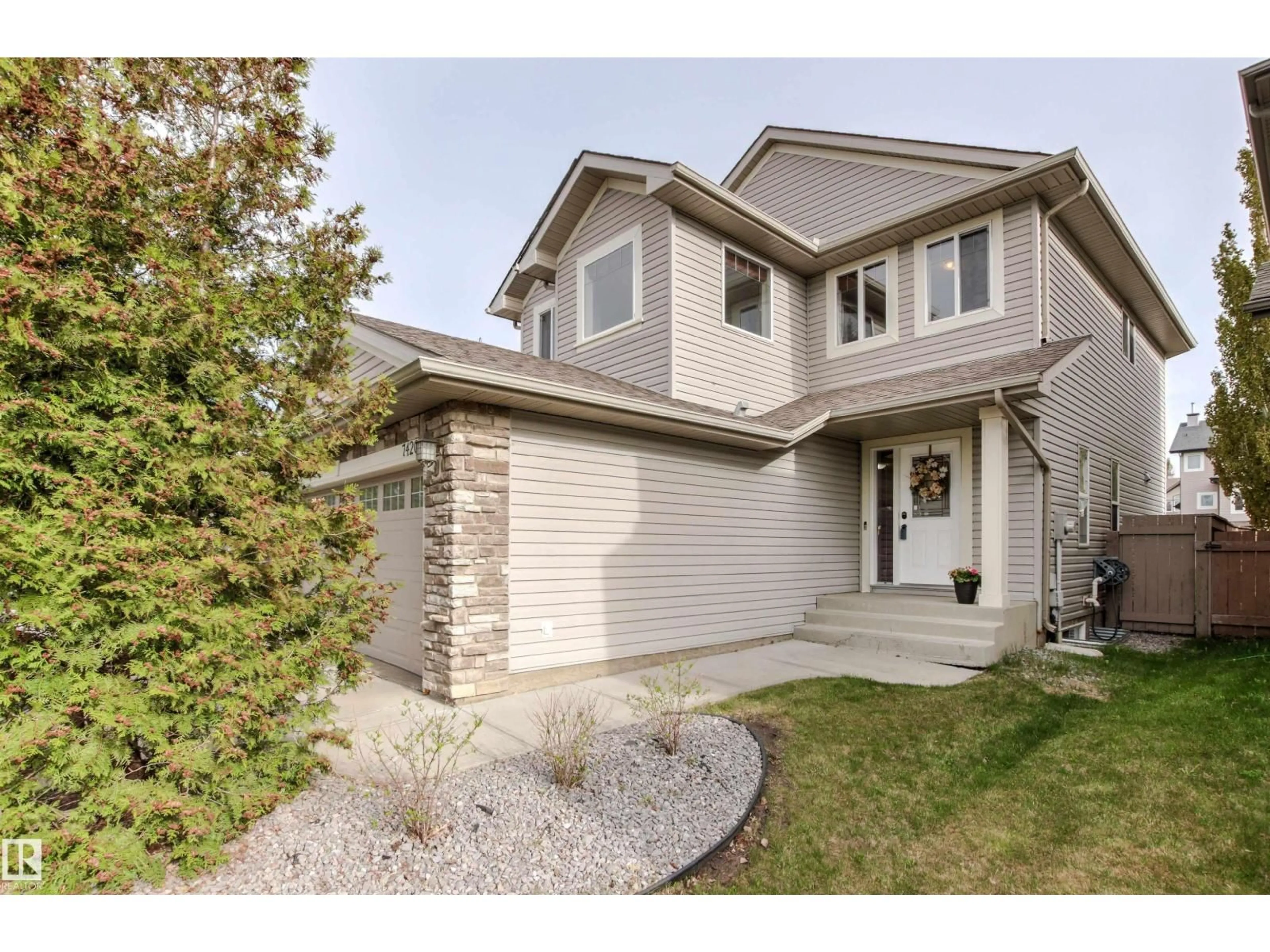 Home with vinyl exterior material, street for 7420 SINGER LANDING LD, Edmonton Alberta T6R3S2