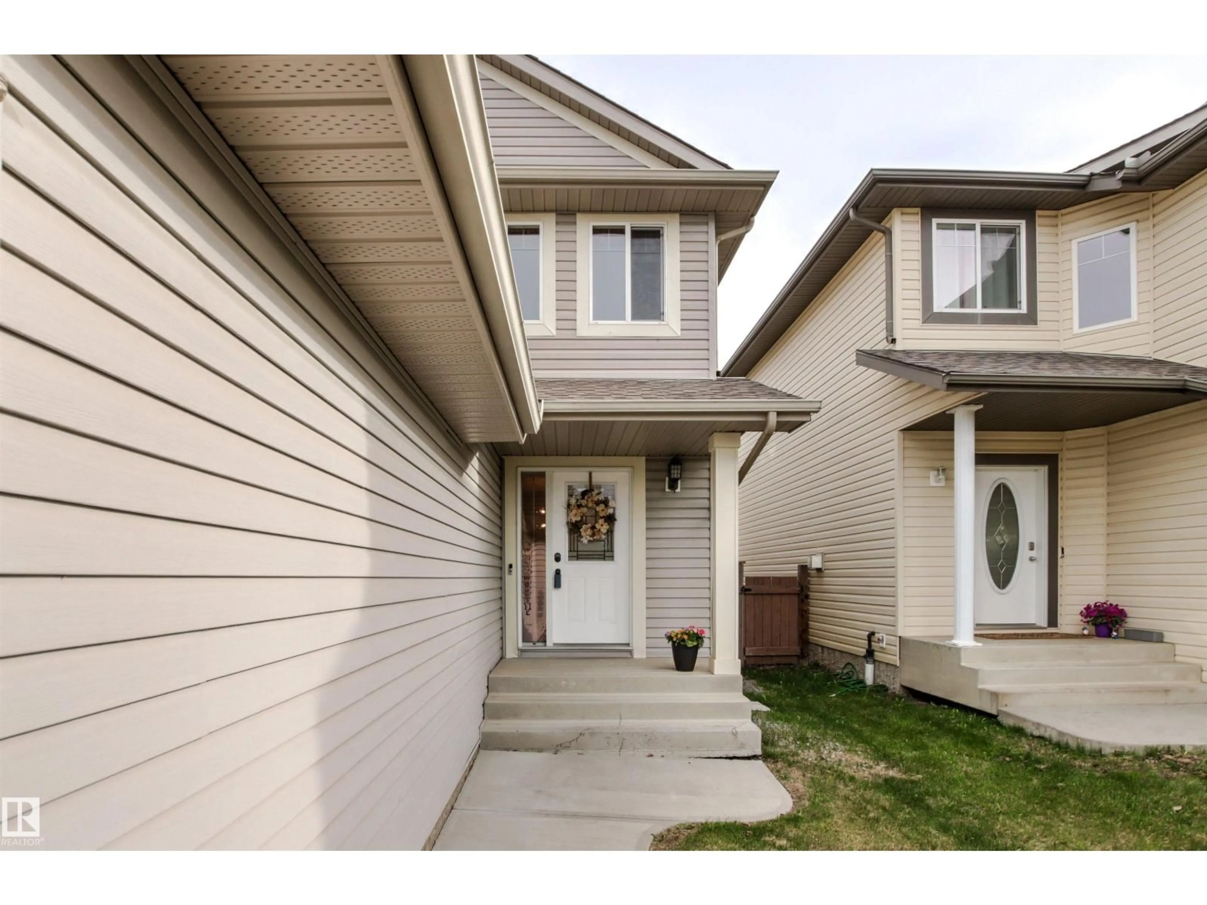 Home with vinyl exterior material, street for 7420 SINGER LANDING LD, Edmonton Alberta T6R3S2