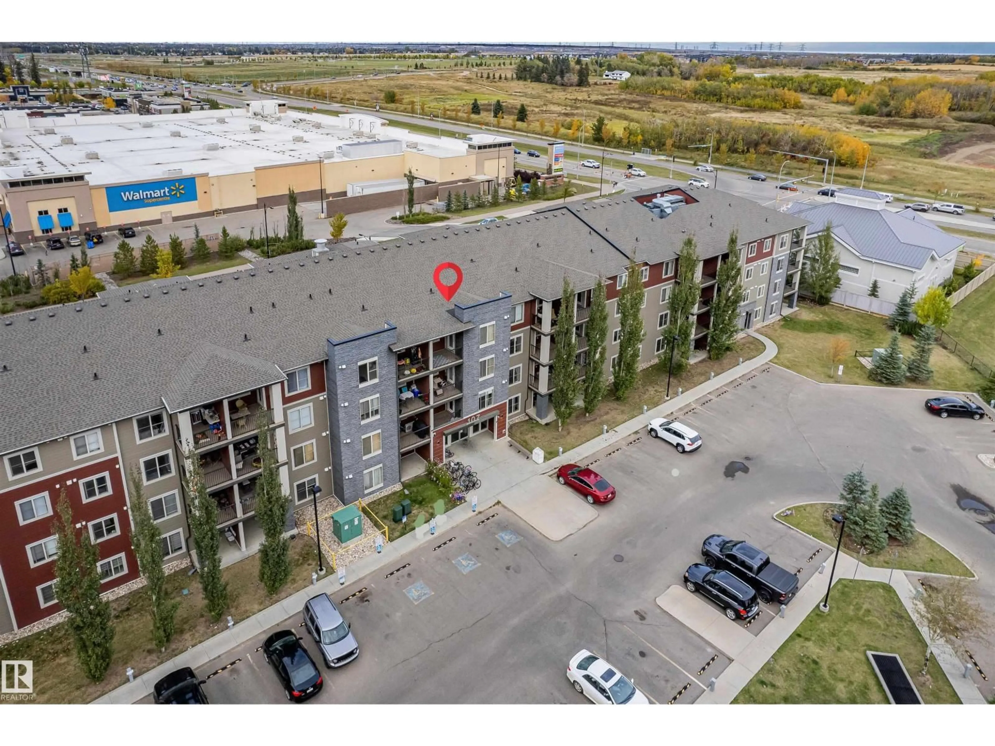 A pic from outside/outdoor area/front of a property/back of a property/a pic from drone, unknown for #208 - 107 WATT CM, Edmonton Alberta T6X2C6