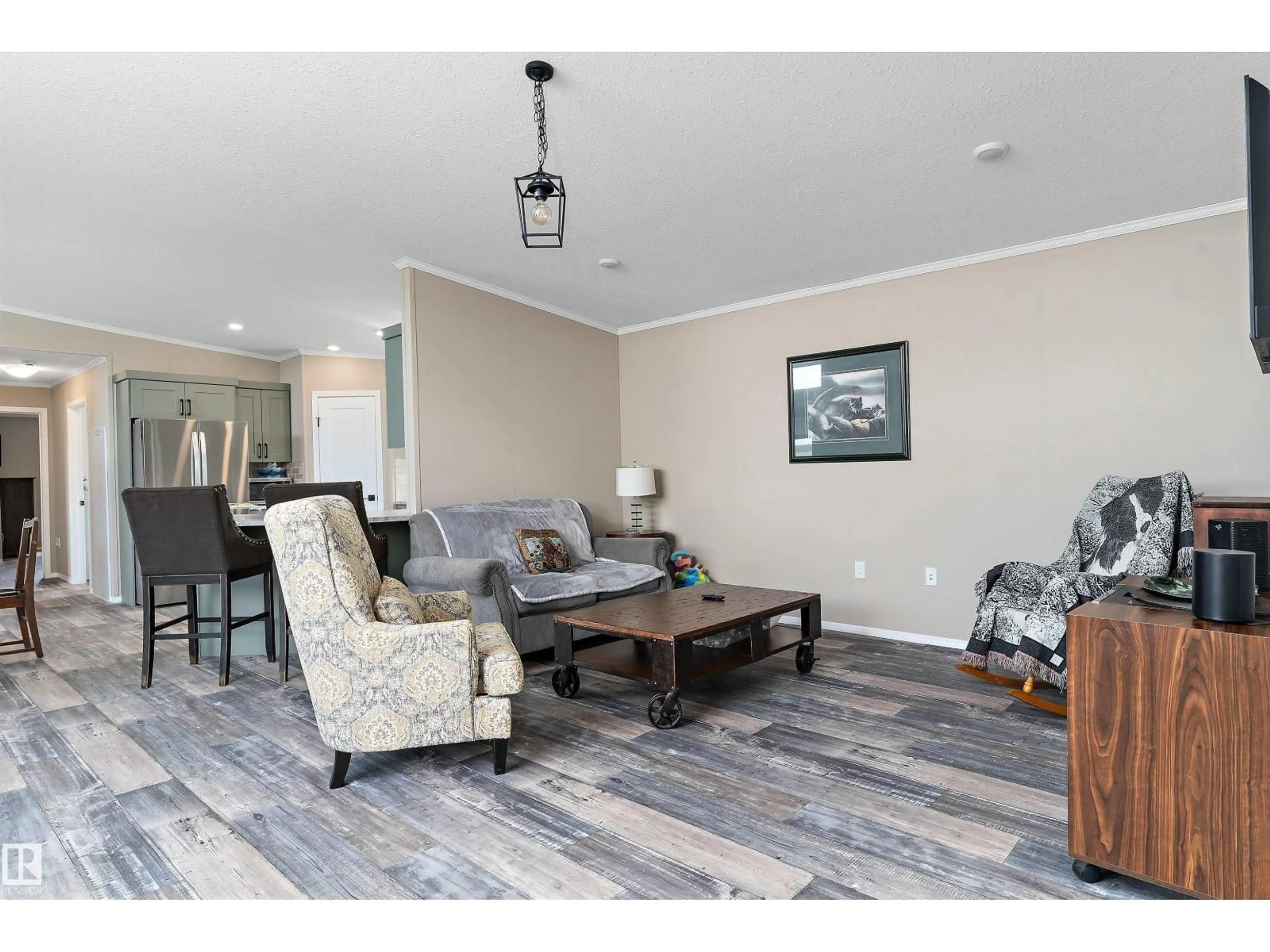 Living room with furniture, wood/laminate floor for 86 MEADOWVIEW RD, Morinville Alberta T8R2P7