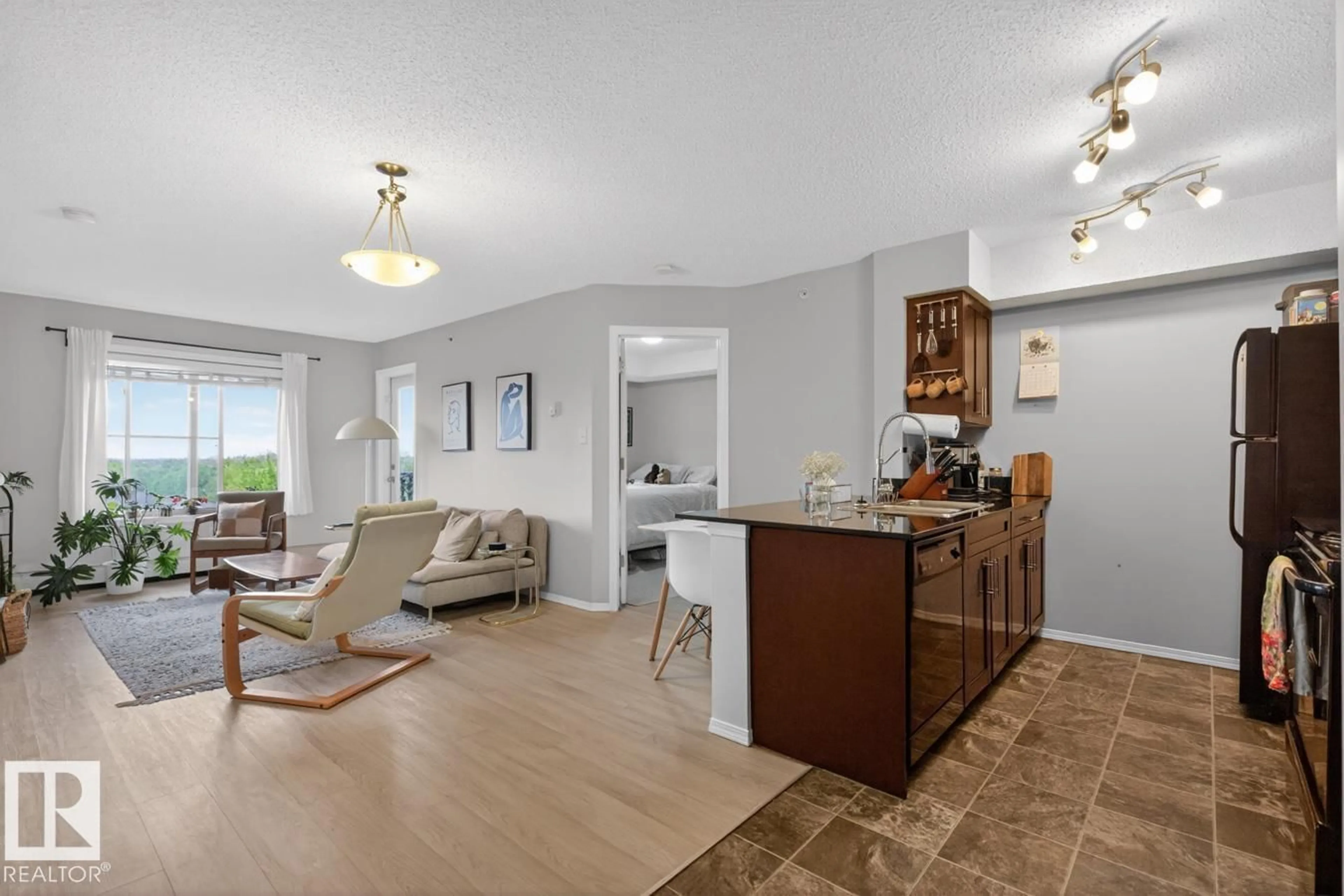 Living room with furniture, unknown for #414 - 1060 MCCONACHIE BV, Edmonton Alberta T5Y0W9