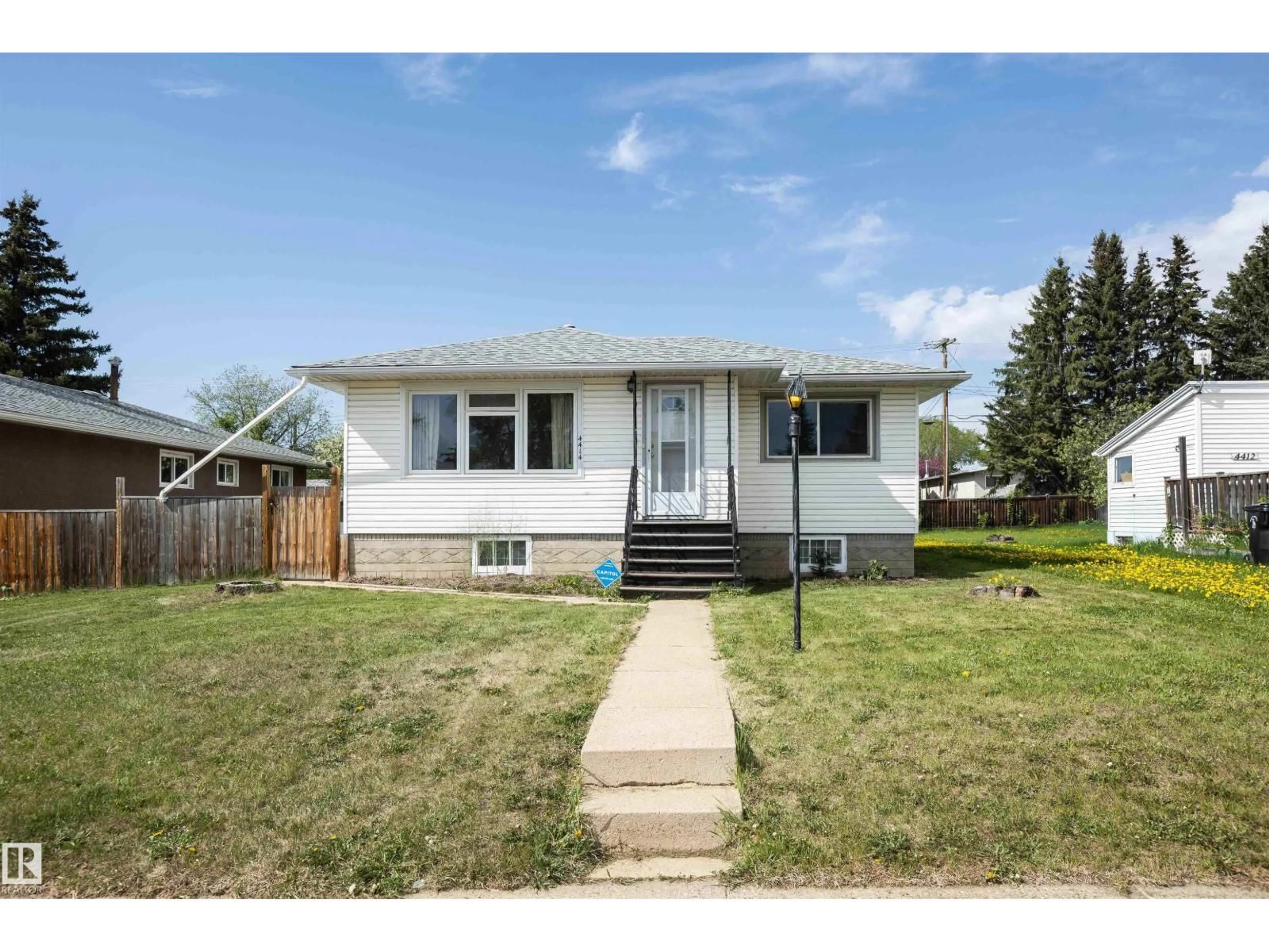 Home with vinyl exterior material, street for 4414 54 AV, Barrhead Alberta T7N1J9