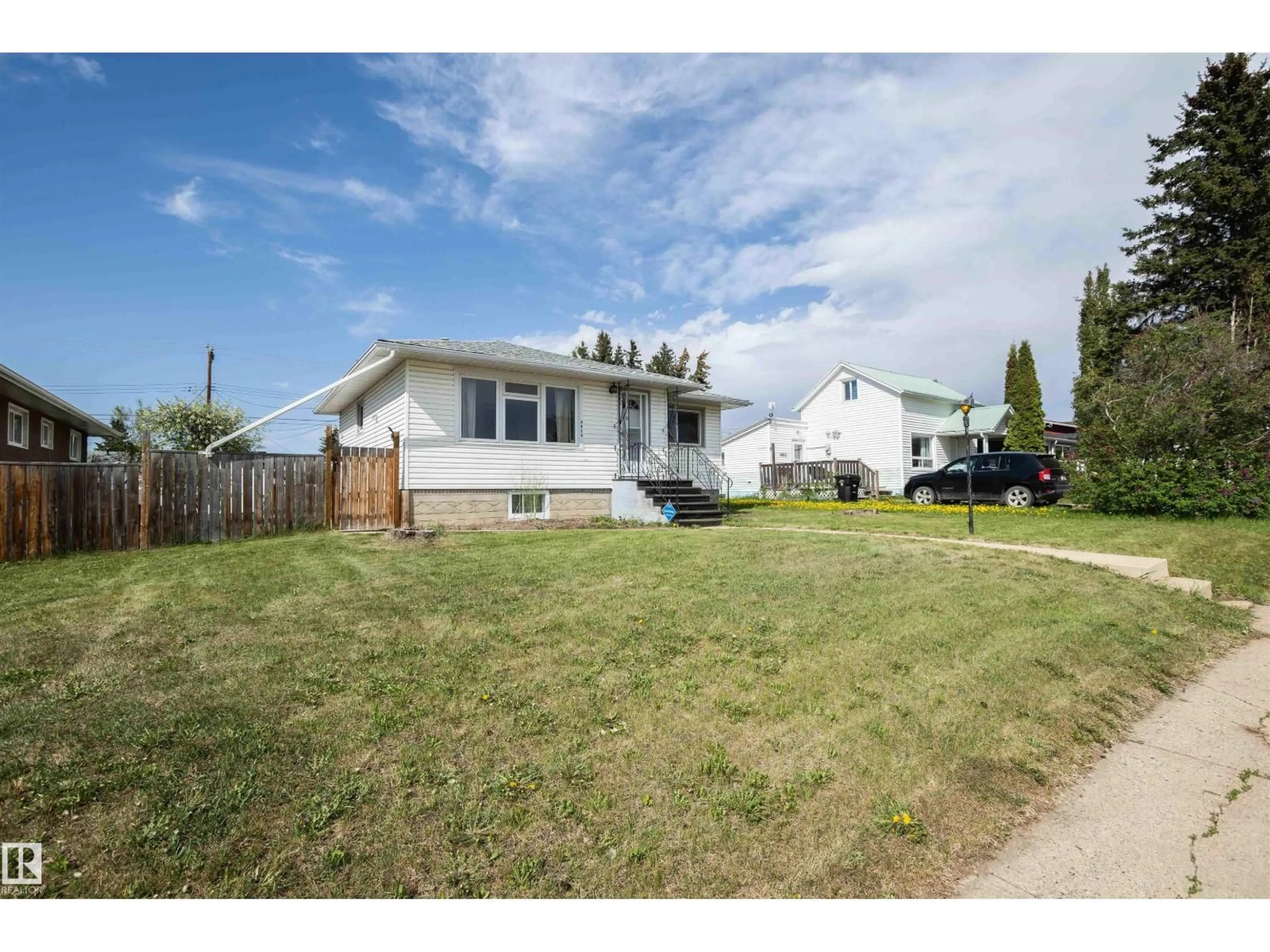 A pic from outside/outdoor area/front of a property/back of a property/a pic from drone, street for 4414 54 AV, Barrhead Alberta T7N1J9