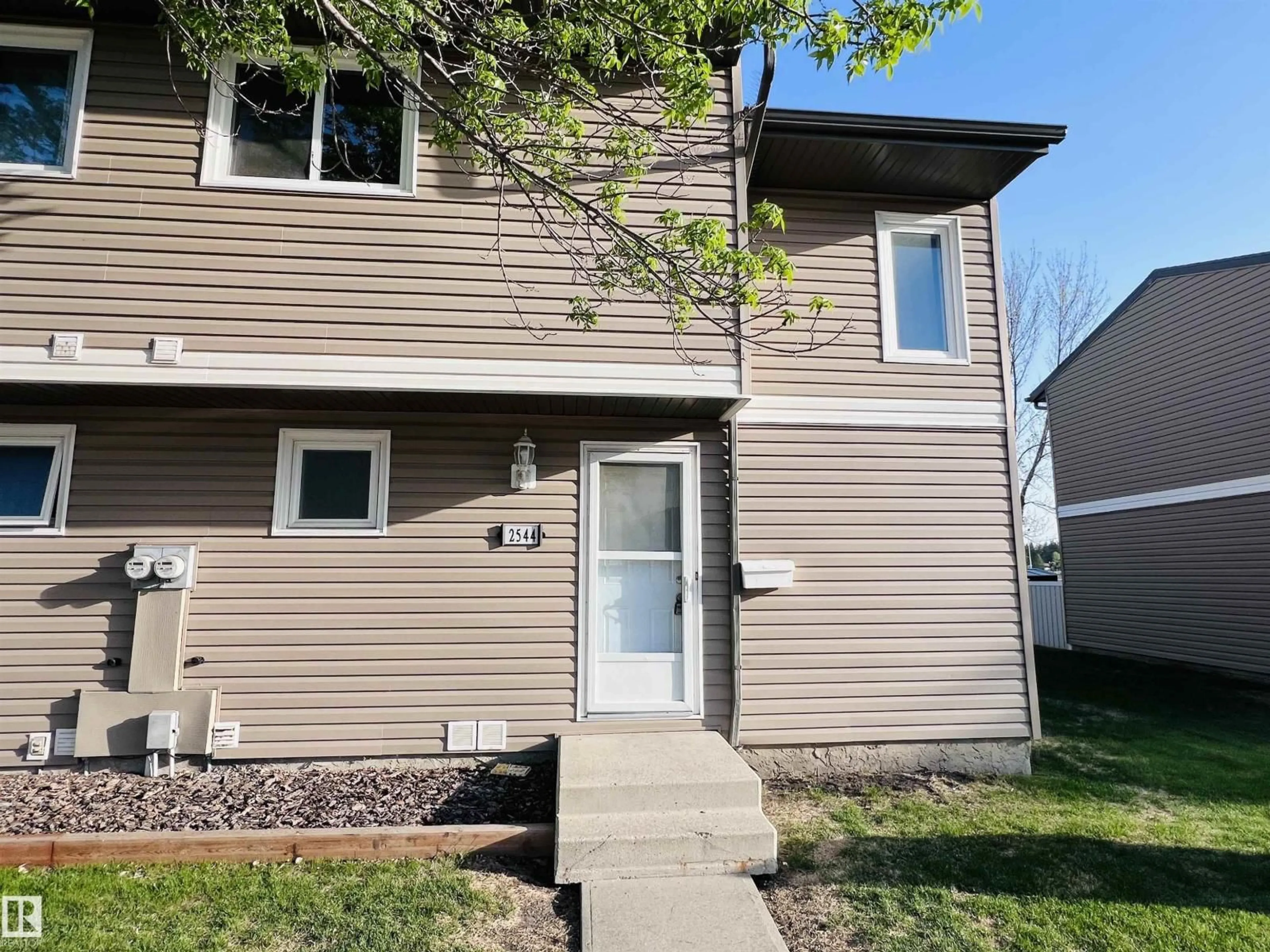 Home with vinyl exterior material, street for 2544 79 ST, Edmonton Alberta T6K3Y4