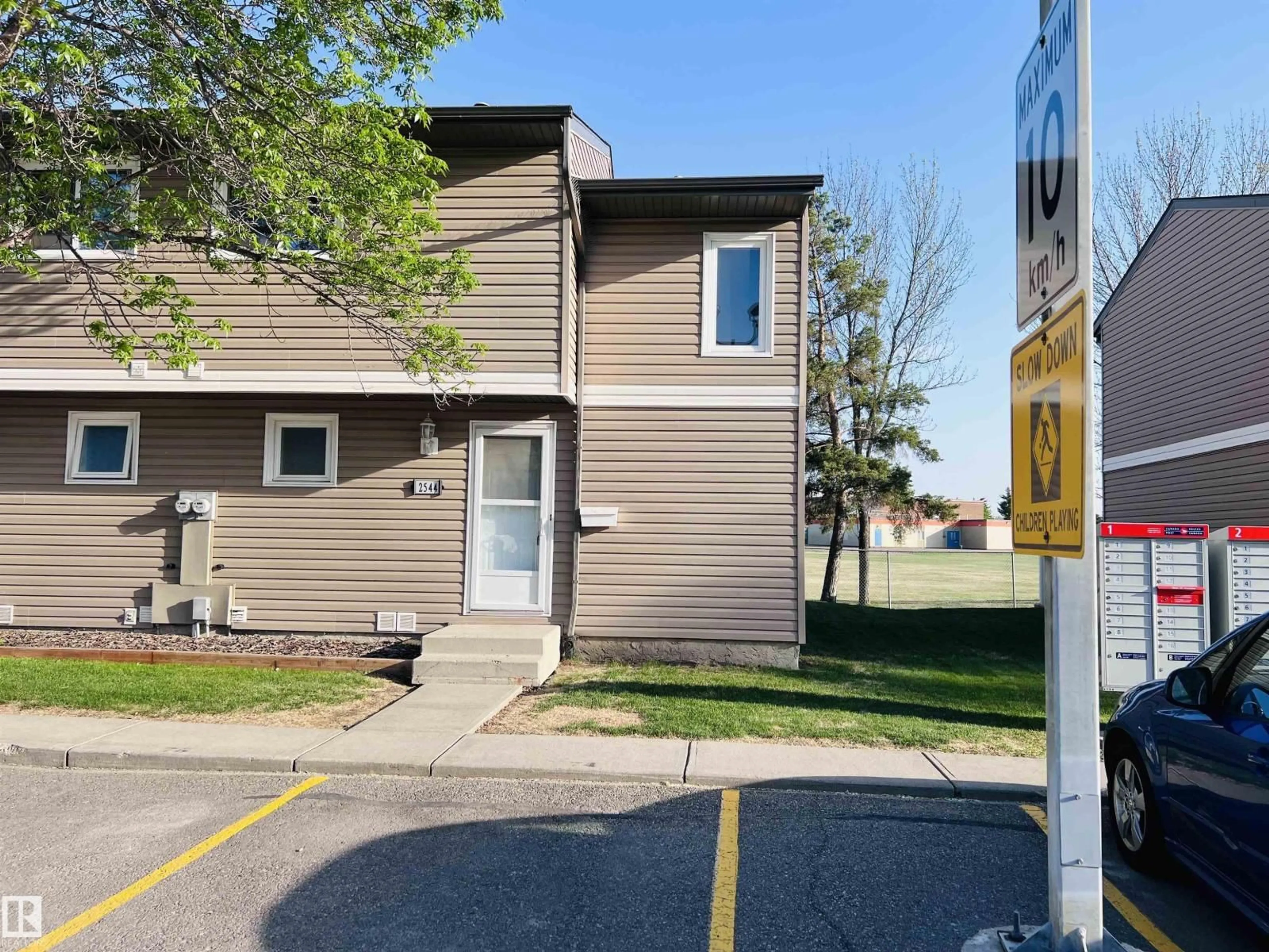Home with vinyl exterior material, street for 2544 79 ST, Edmonton Alberta T6K3Y4