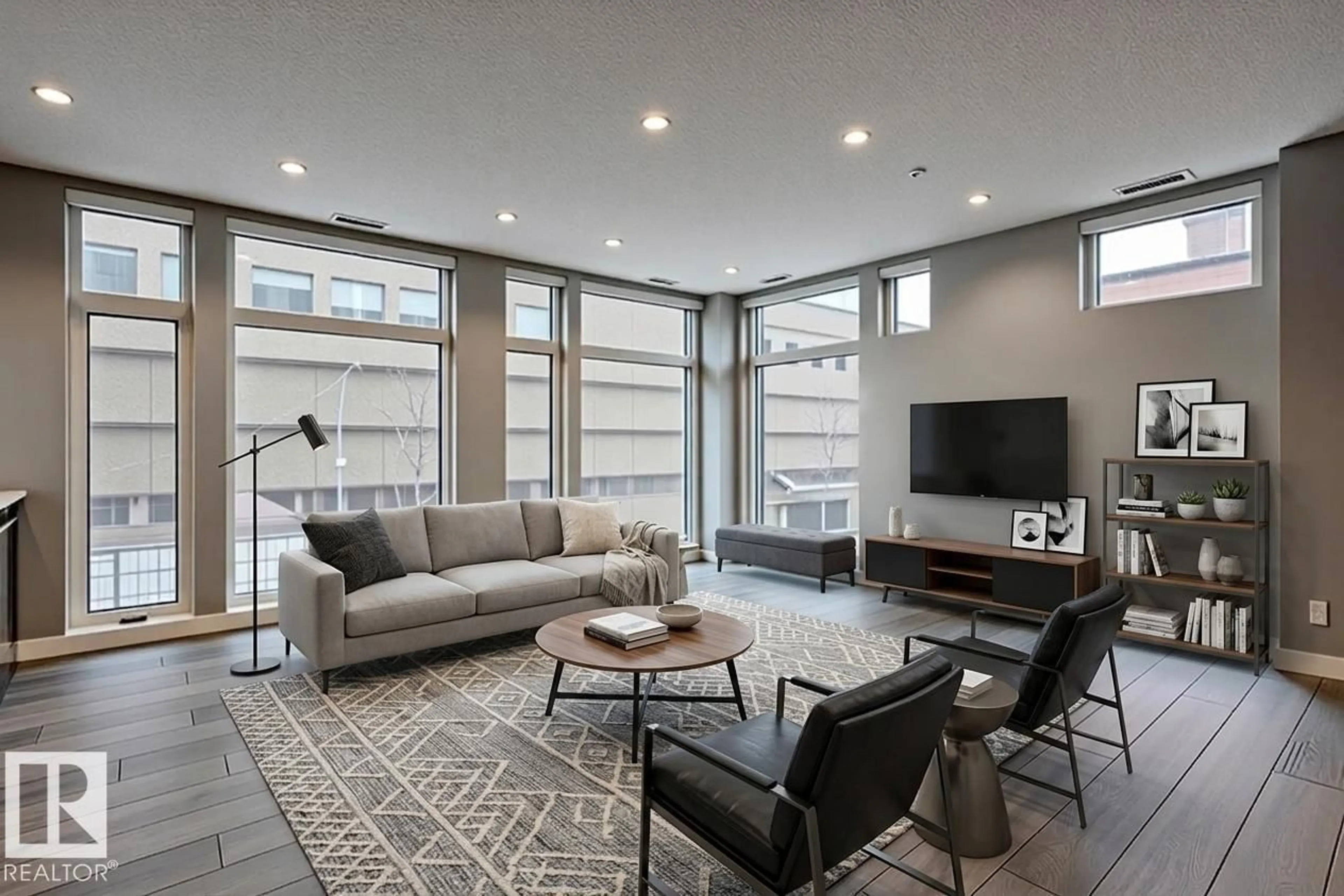 Living room with furniture, cement floor for #401 - 10238 103 ST NW, Edmonton Alberta T5J0G6