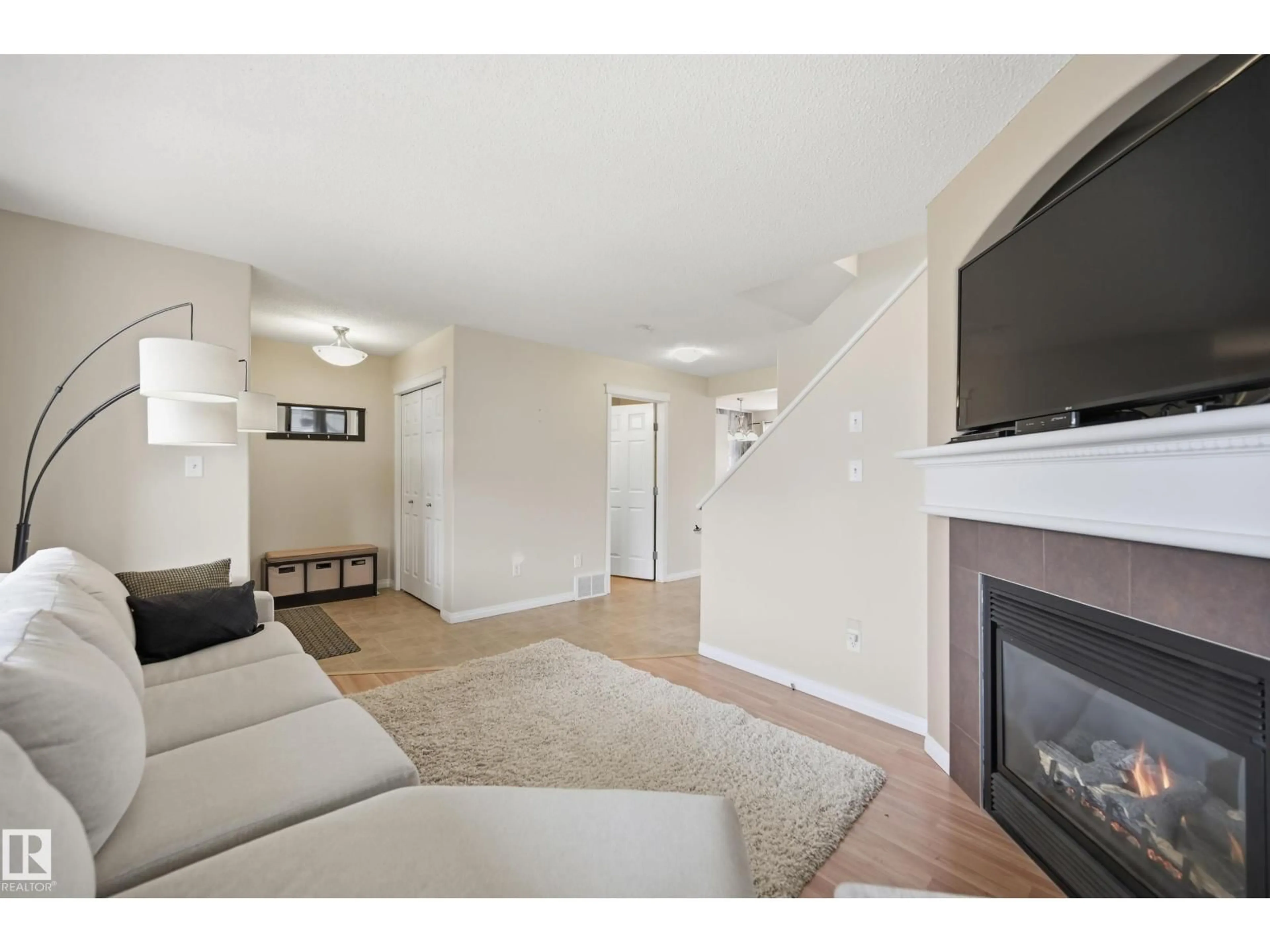 Living room with furniture, wood/laminate floor for 11628 167A AV, Edmonton Alberta T5X6J5