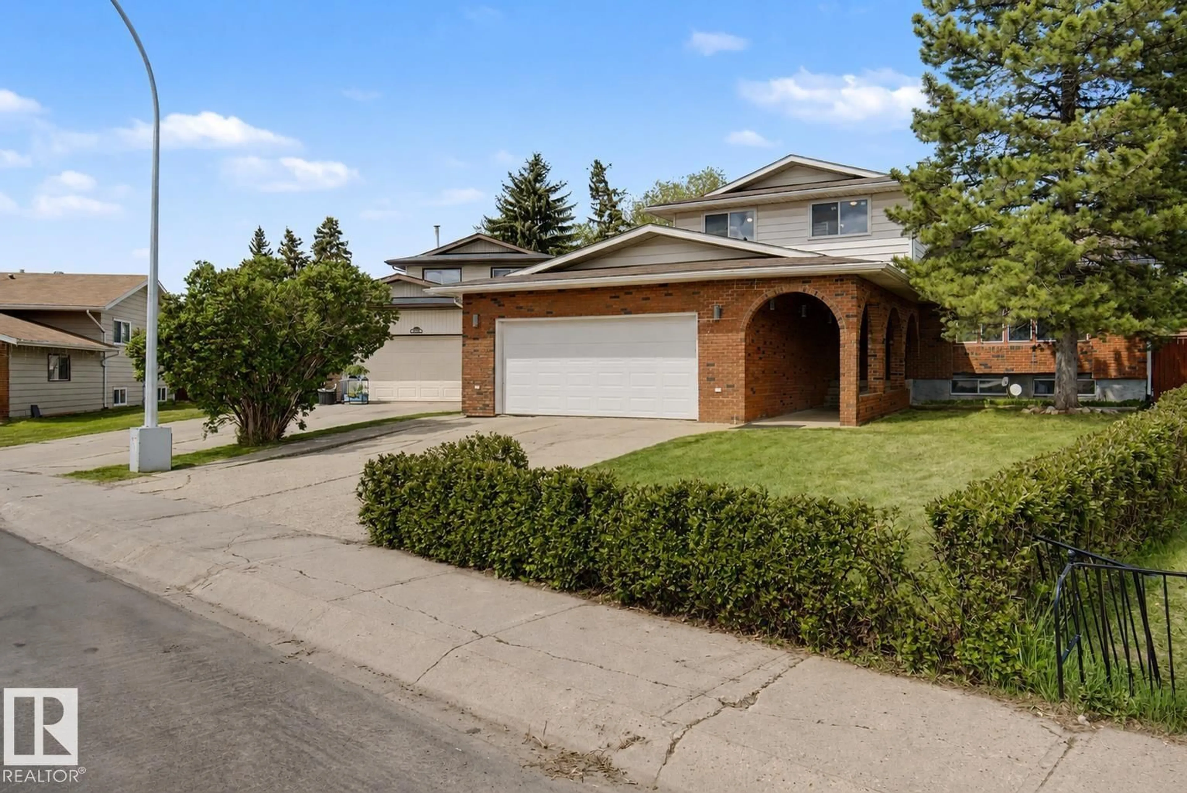 Home with brick exterior material, street for NW - 2068 45 ST, Edmonton Alberta T6L2V1