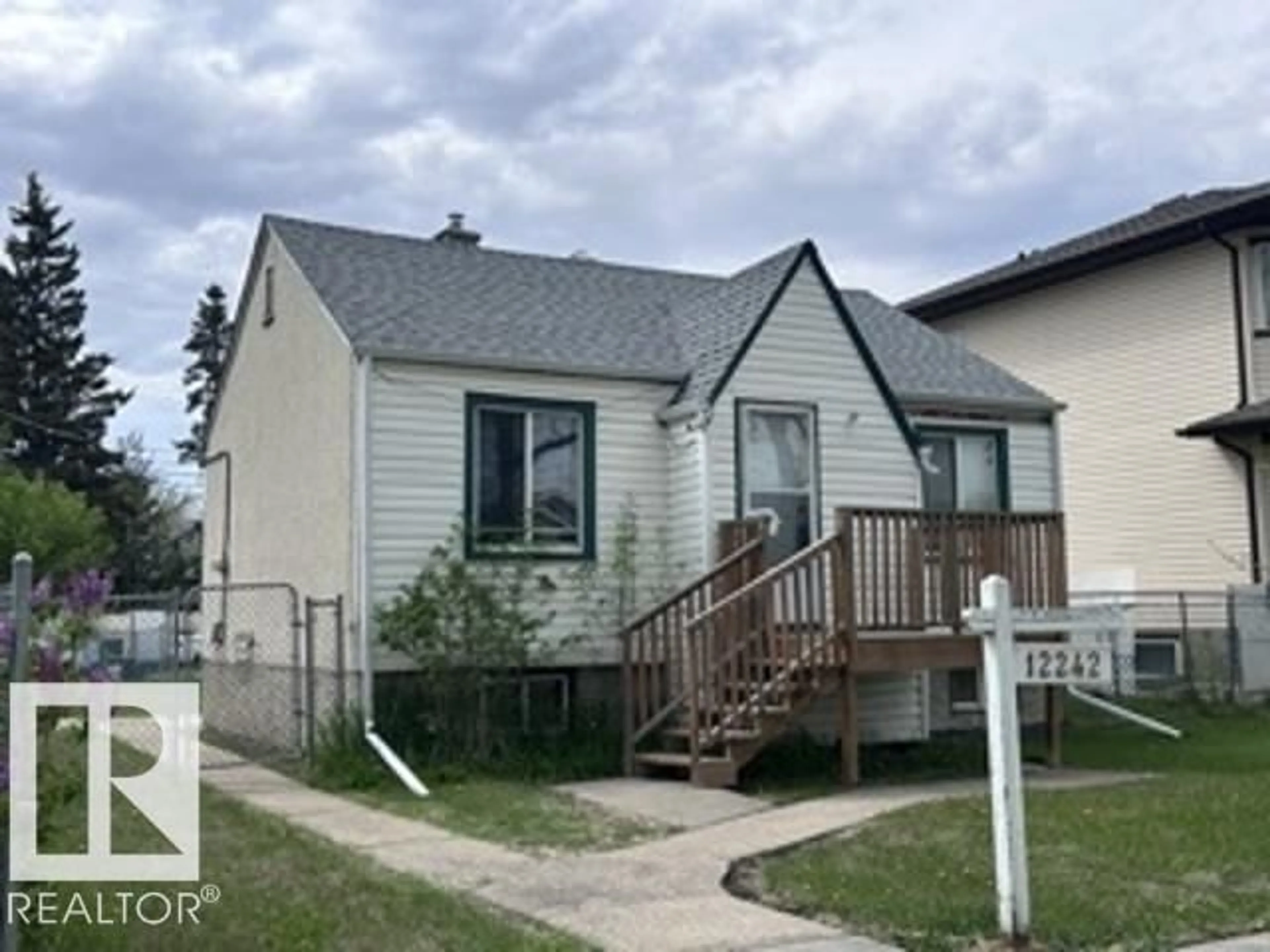 Home with vinyl exterior material, street for NW - 12242 91 ST, Edmonton Alberta T5B4C3