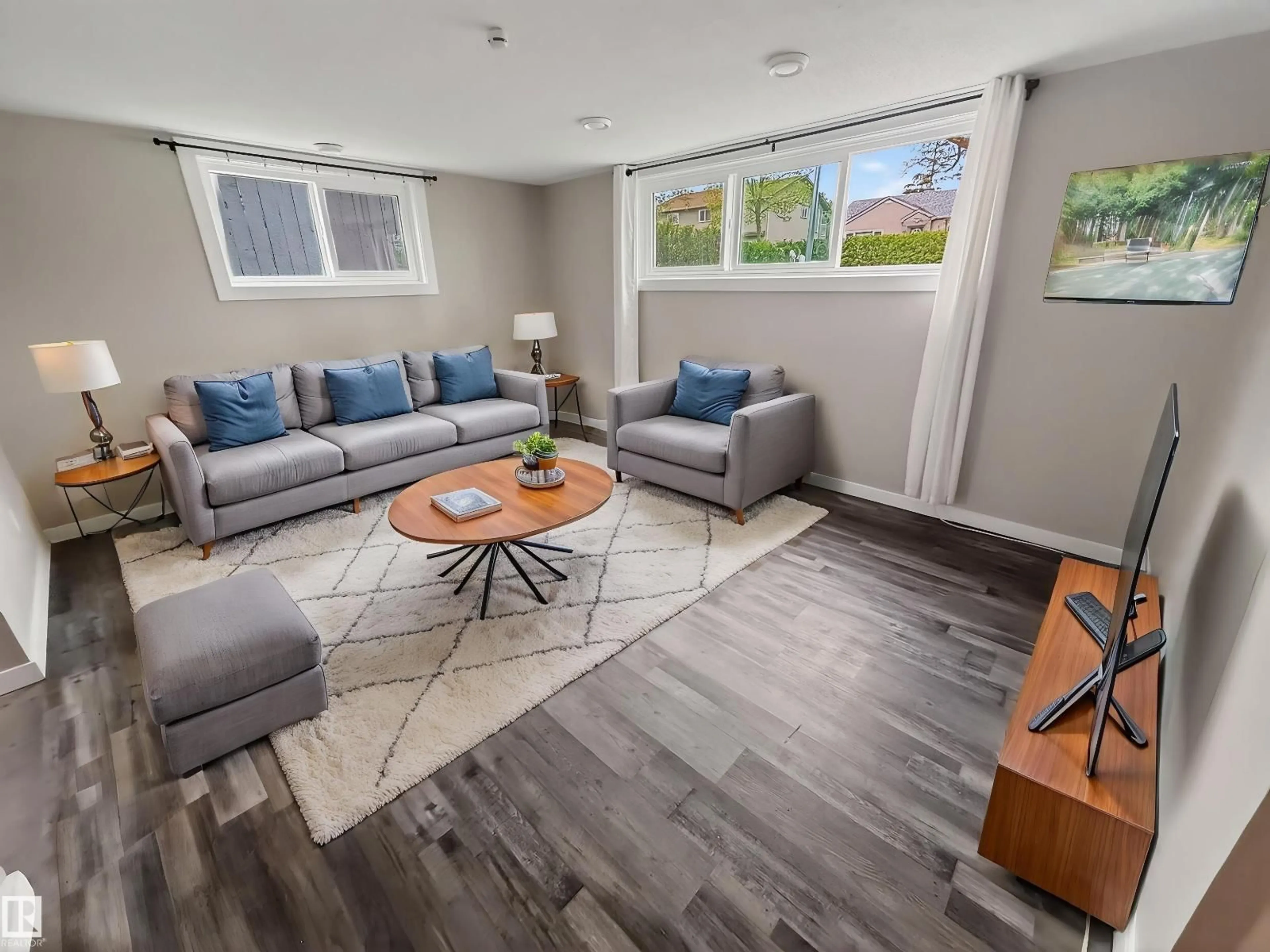 Living room with furniture, wood/laminate floor for NW - 12943 123 ST, Edmonton Alberta T5L0J6
