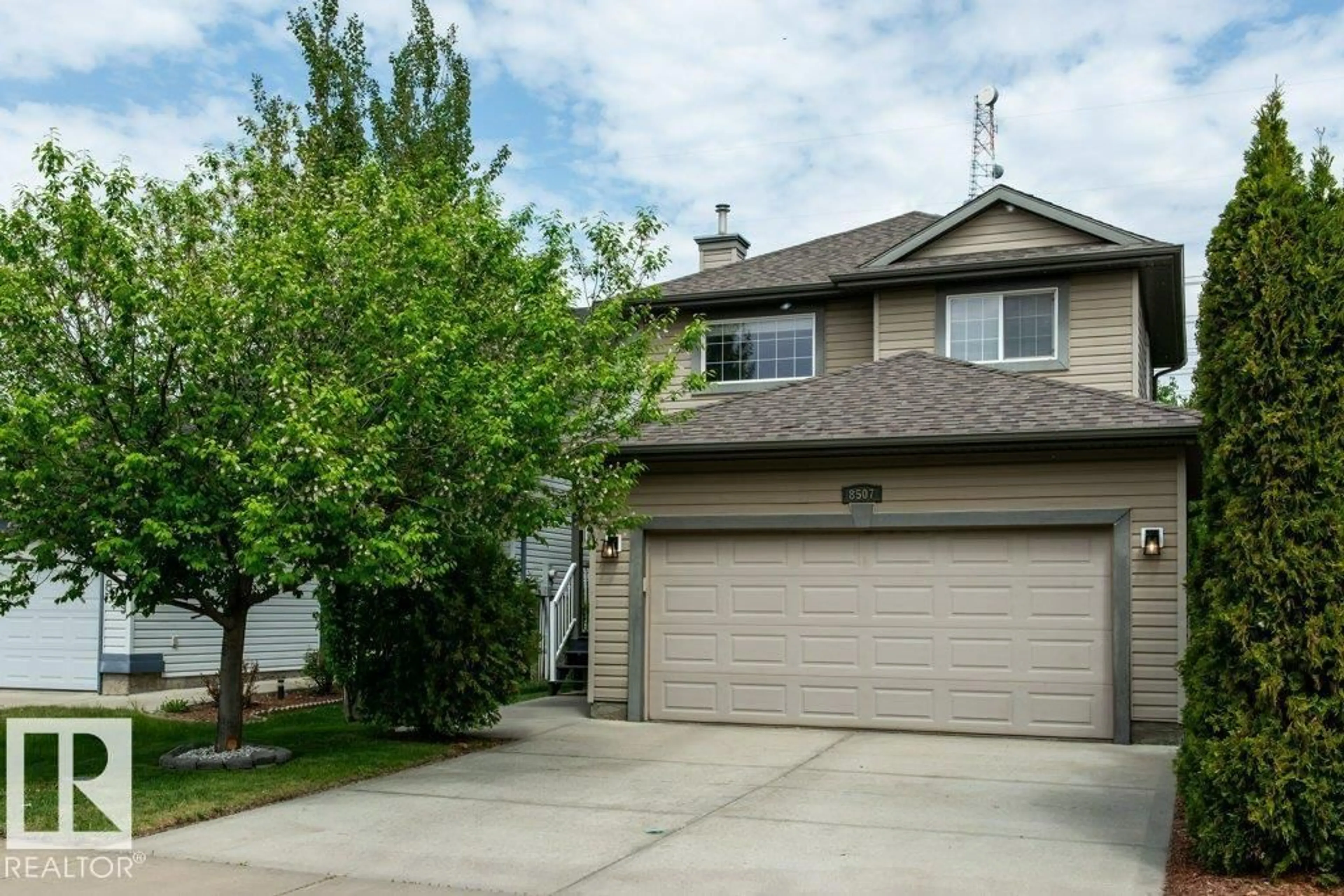 Home with vinyl exterior material, street for 8507 2 AV SW, Edmonton Alberta T6X1H5
