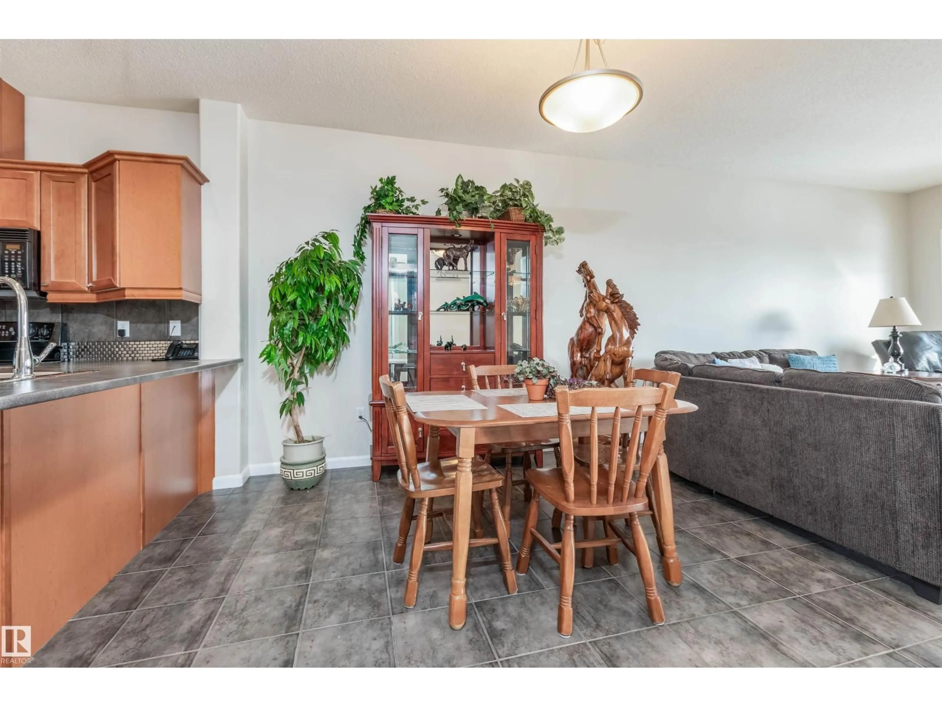 Dining room, wood/laminate floor for 300 - 439 PALISADES WY, Sherwood Park Alberta T8H2T9