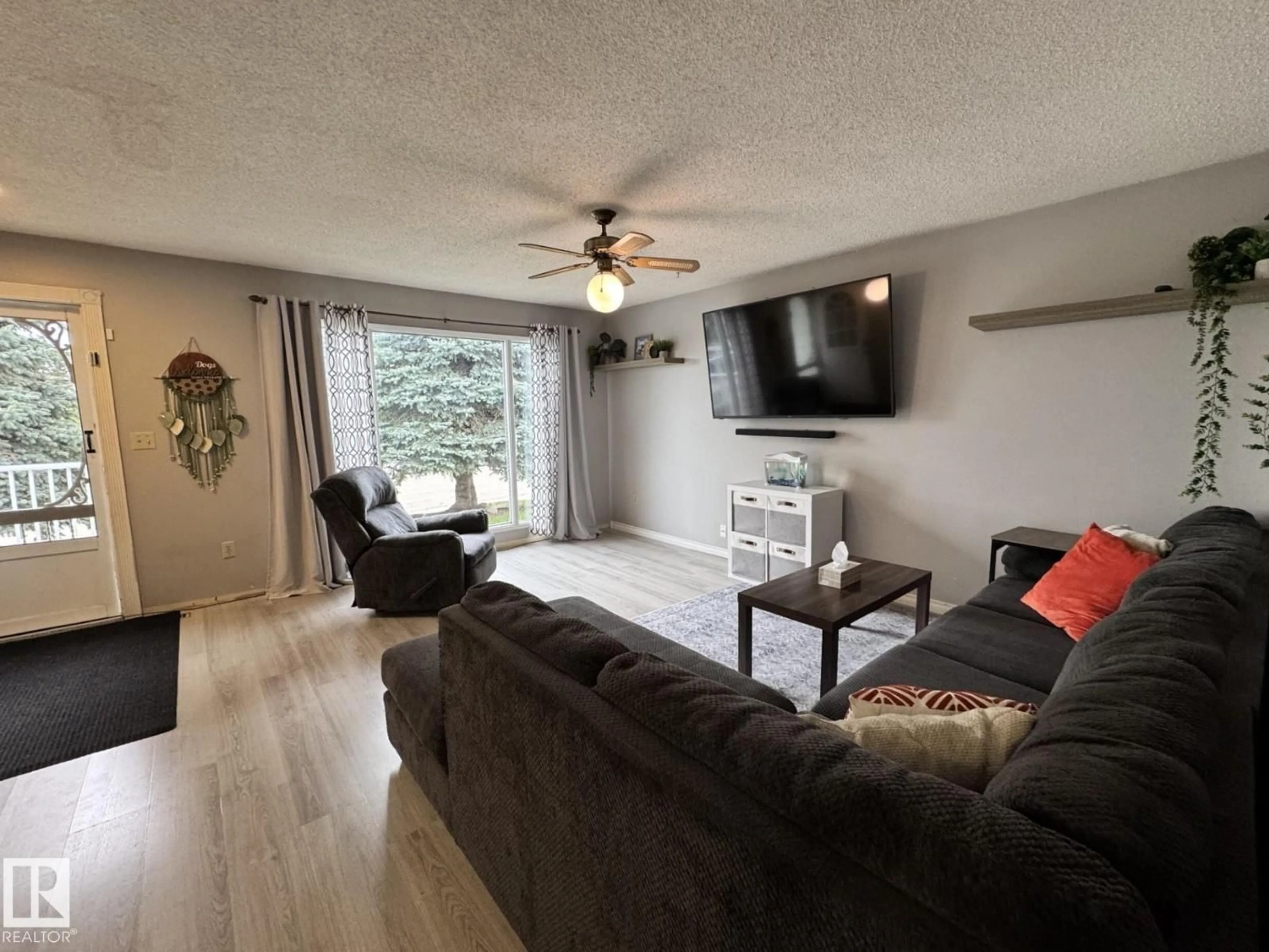Living room with furniture, wood/laminate floor for 4617 47 AV, Evansburg Alberta T0E0T0