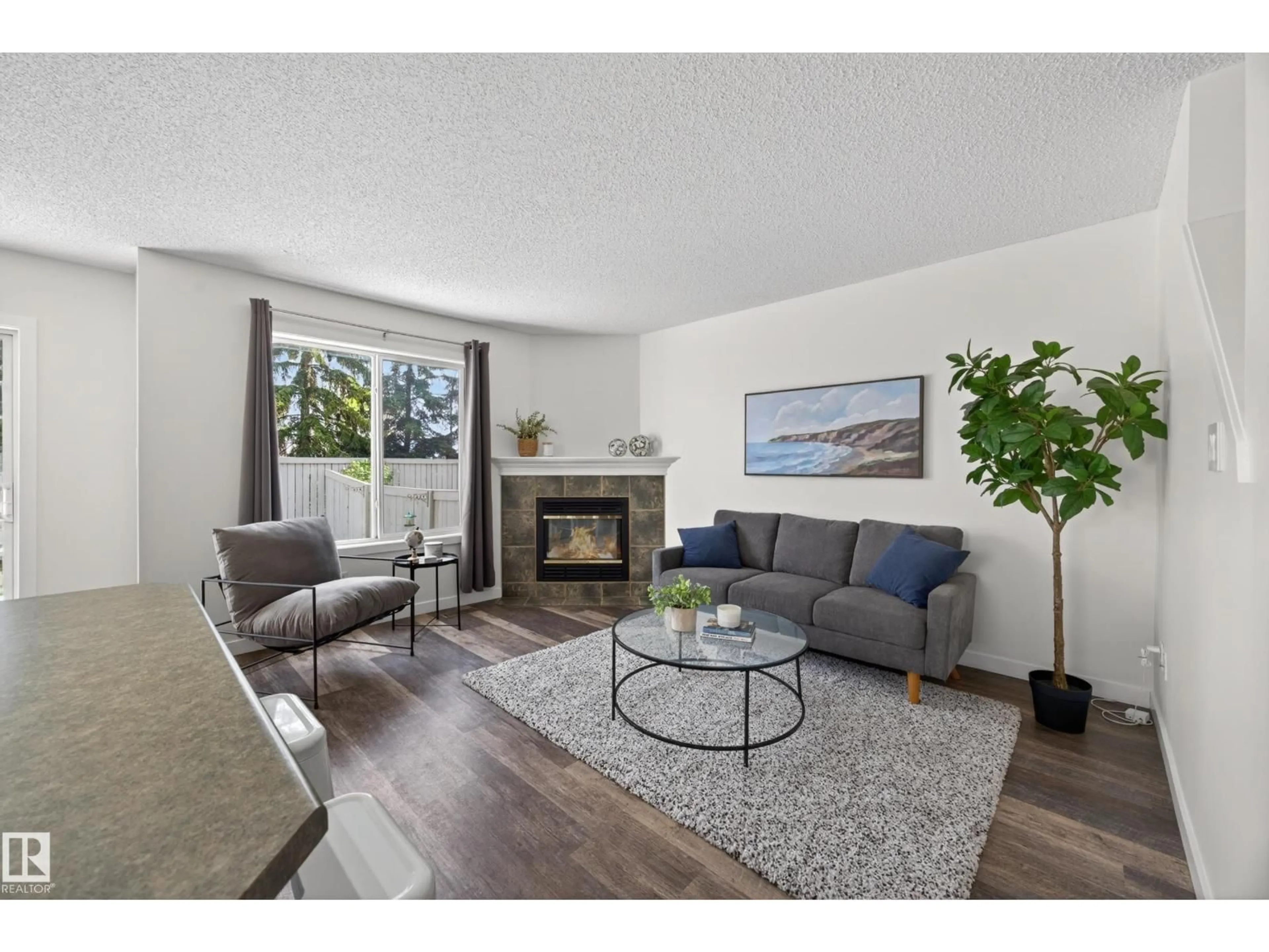 Living room with furniture, wood/laminate floor for #39 - 4020 21 ST, Edmonton Alberta T6T1T8