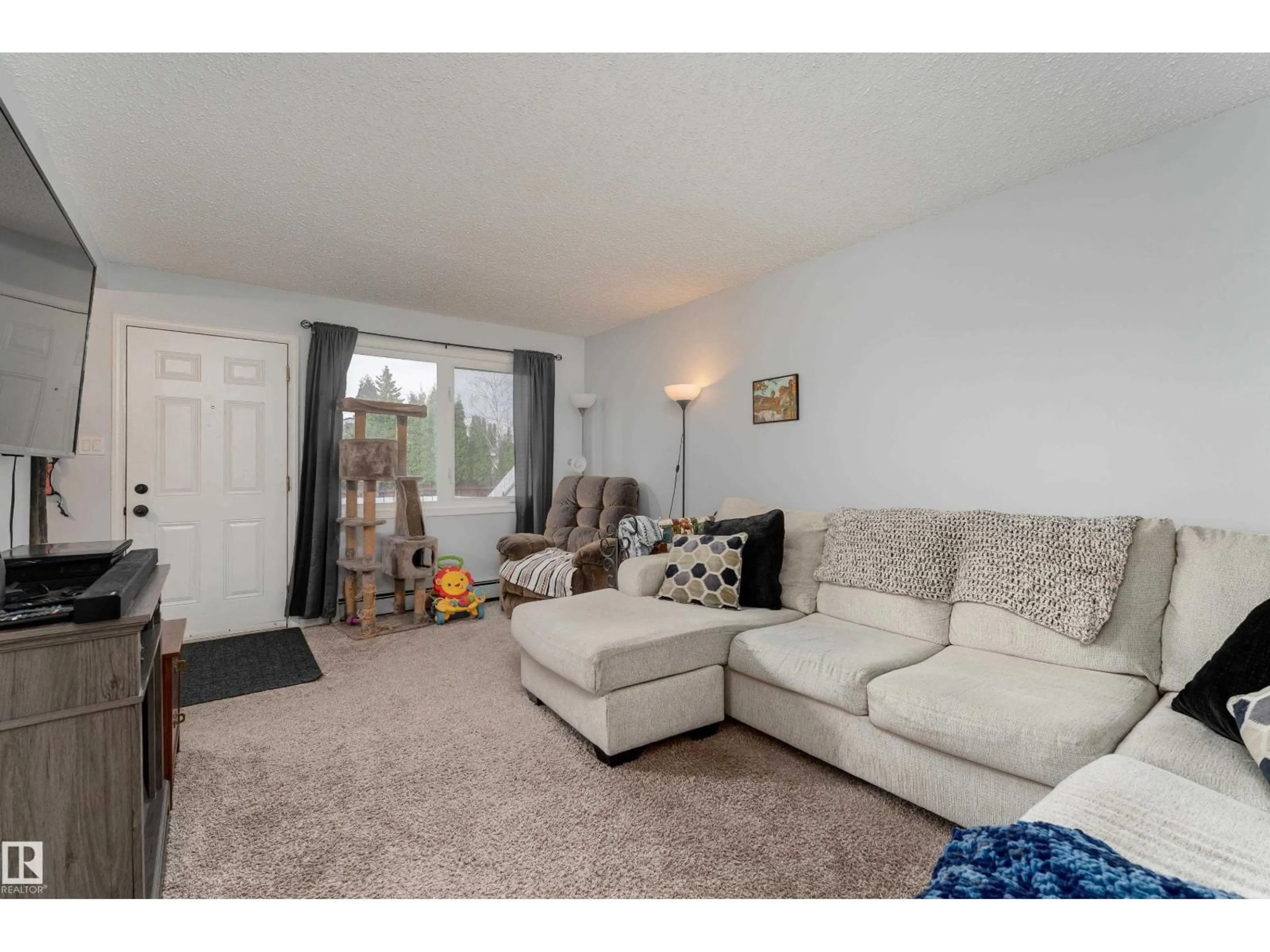 Living room with furniture, unknown for 116 16348 109 ST NW, Edmonton Alberta T5X2T4