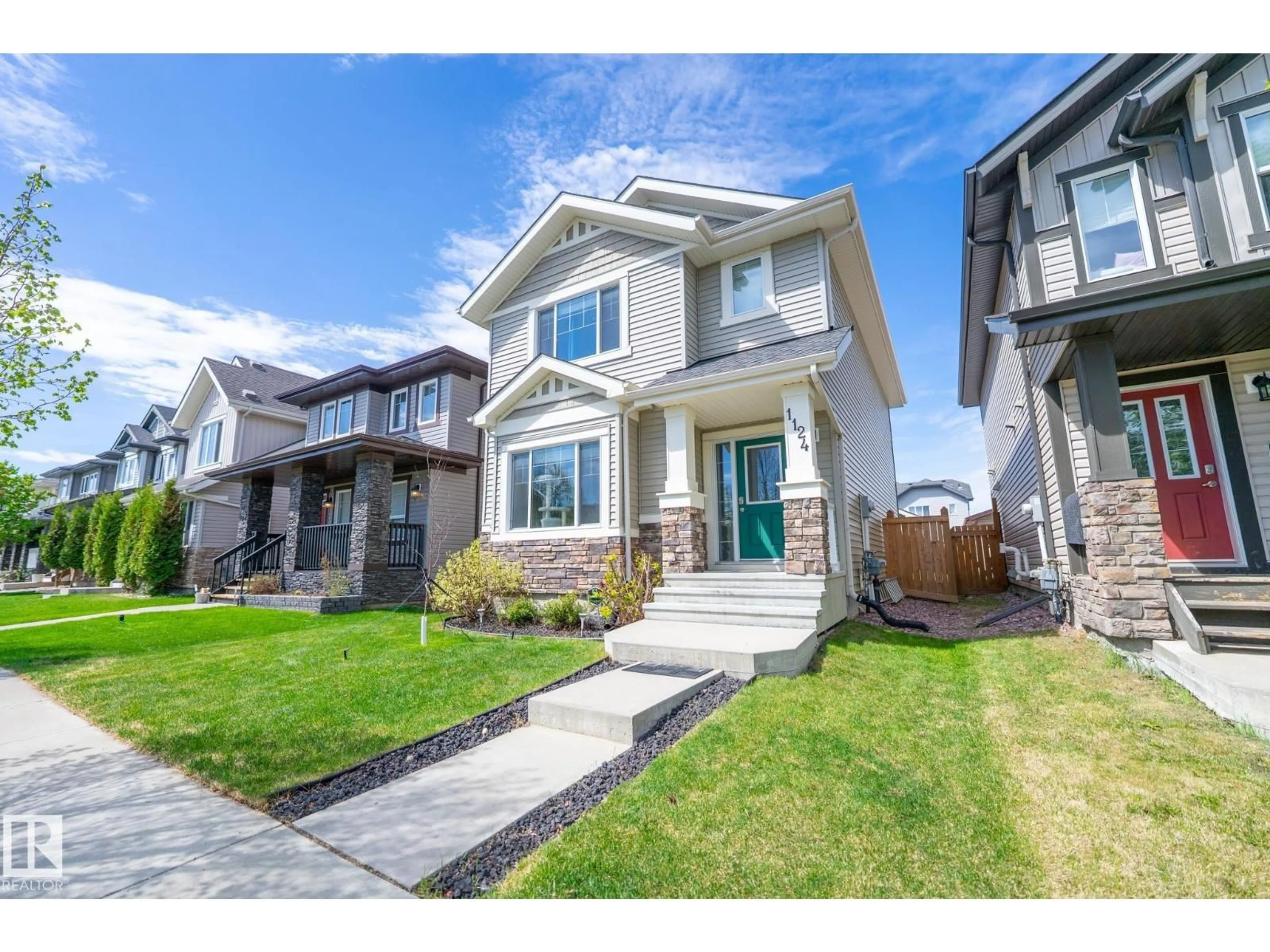 Home with vinyl exterior material, street for 1124 161 ST, Edmonton Alberta T6W1A4