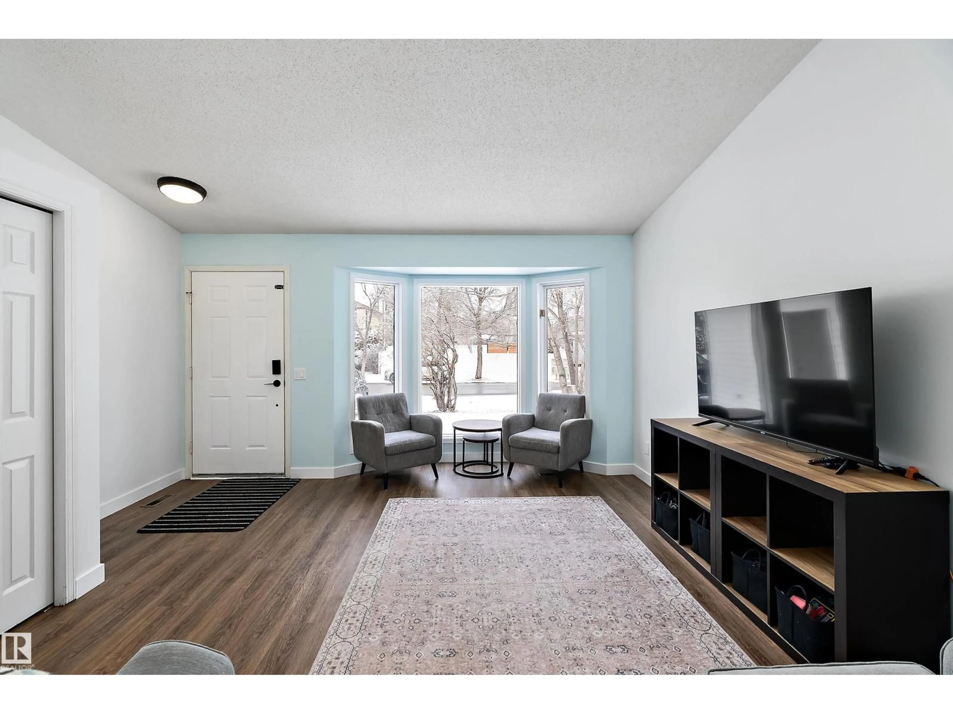 Living room with furniture, wood/laminate floor for 49 DEERBOURNE DR, St. Albert Alberta T8N4R2