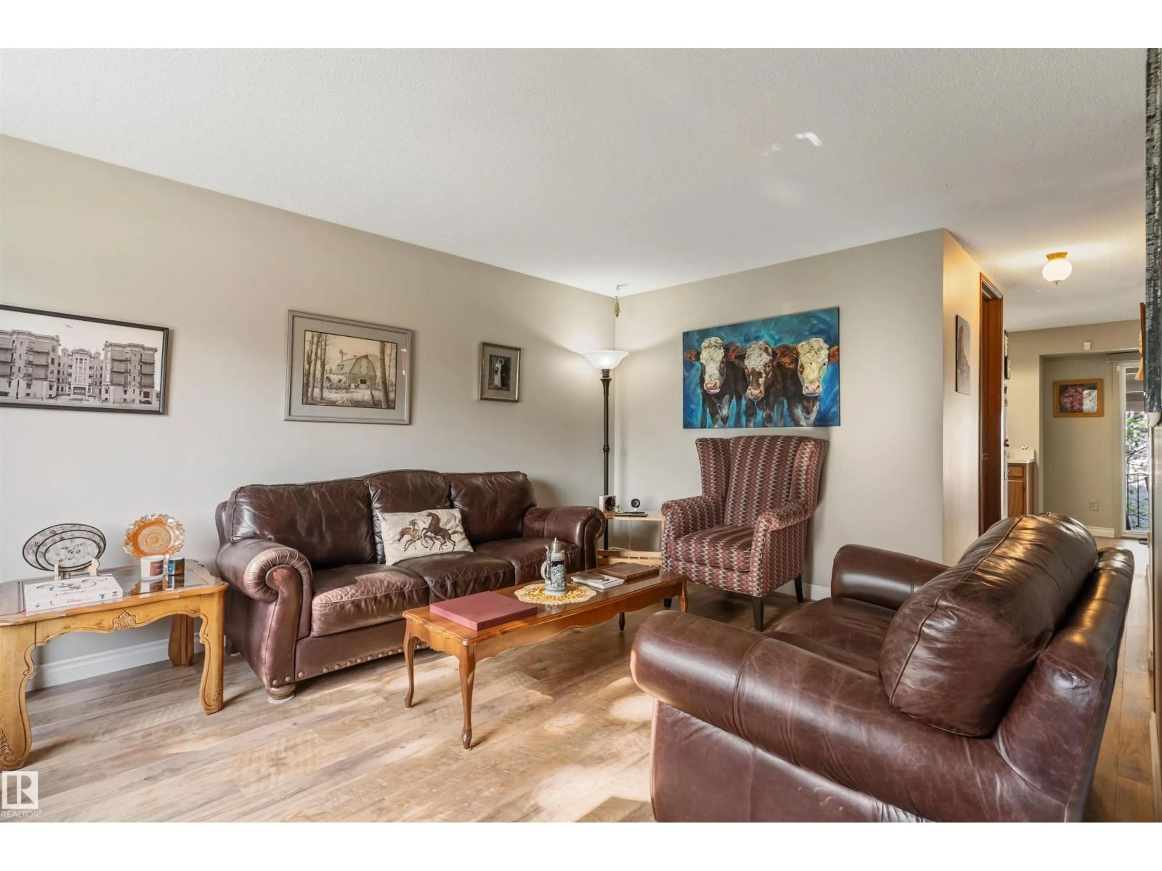 Living room with furniture, wood/laminate floor for NW - 1736 36 ST, Edmonton Alberta T6L2P5