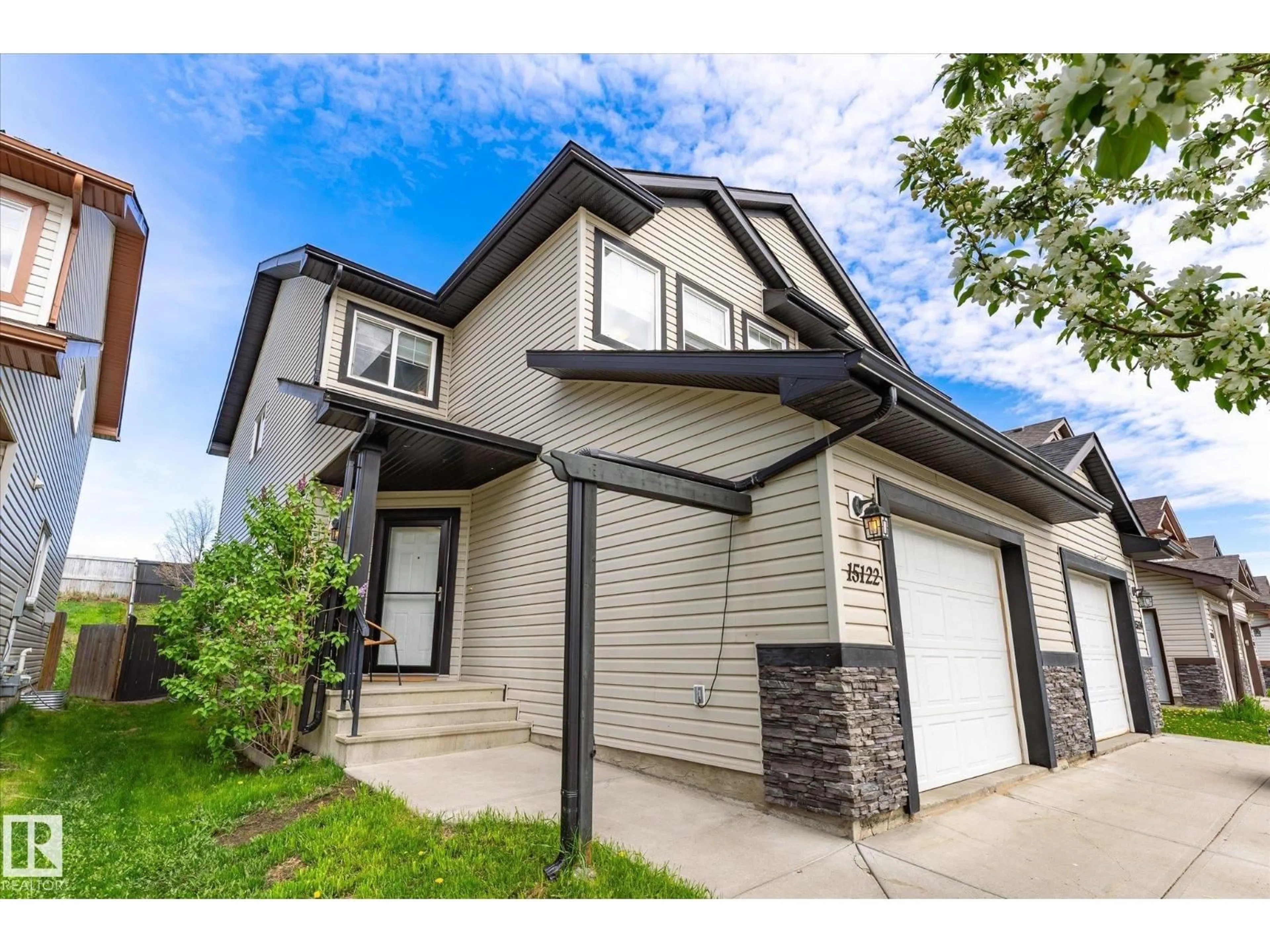 Home with vinyl exterior material, street for 15122 33 ST, Edmonton Alberta T5Y0J7