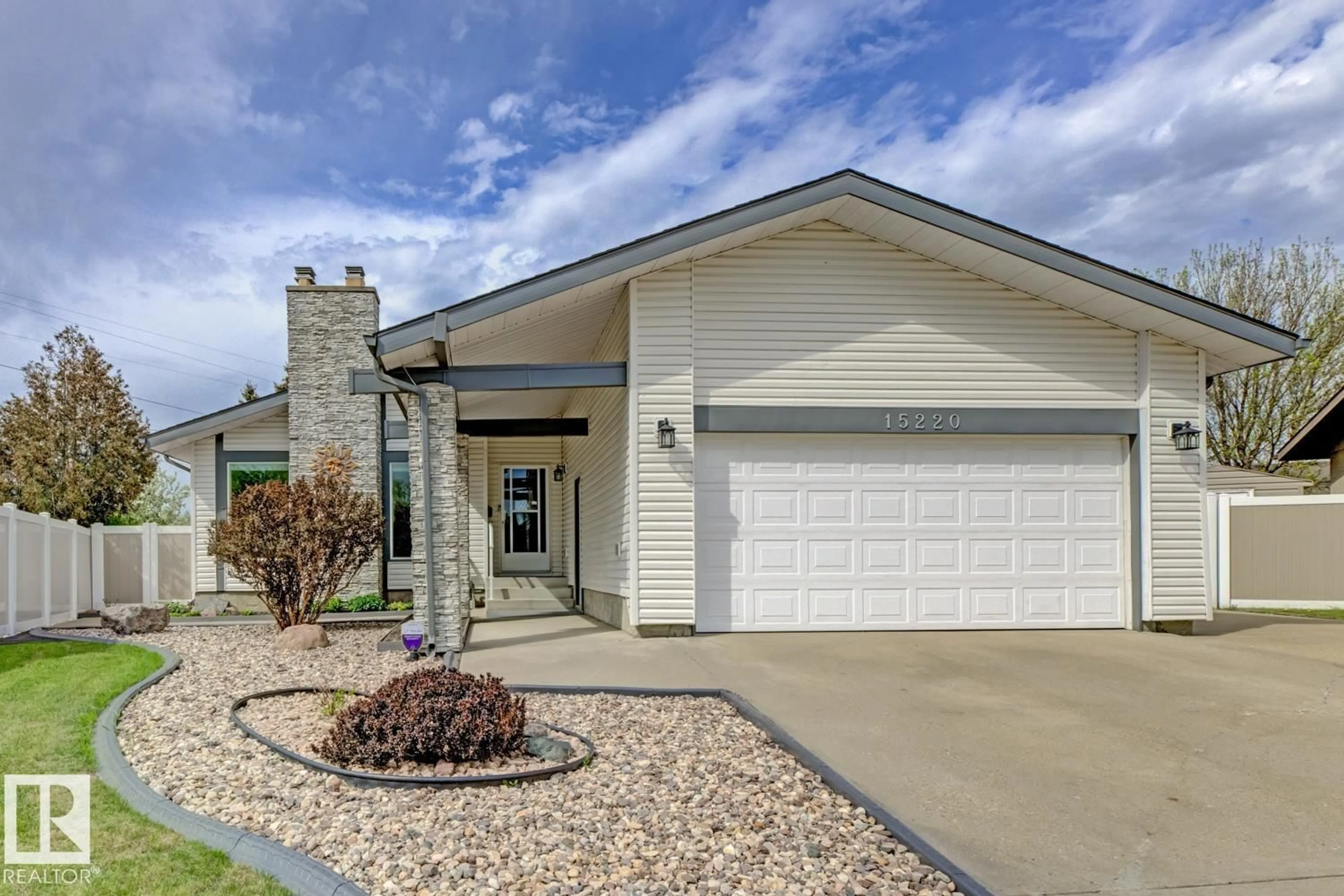 Home with vinyl exterior material, street for 15220 124 ST NW, Edmonton Alberta T5X1Z3