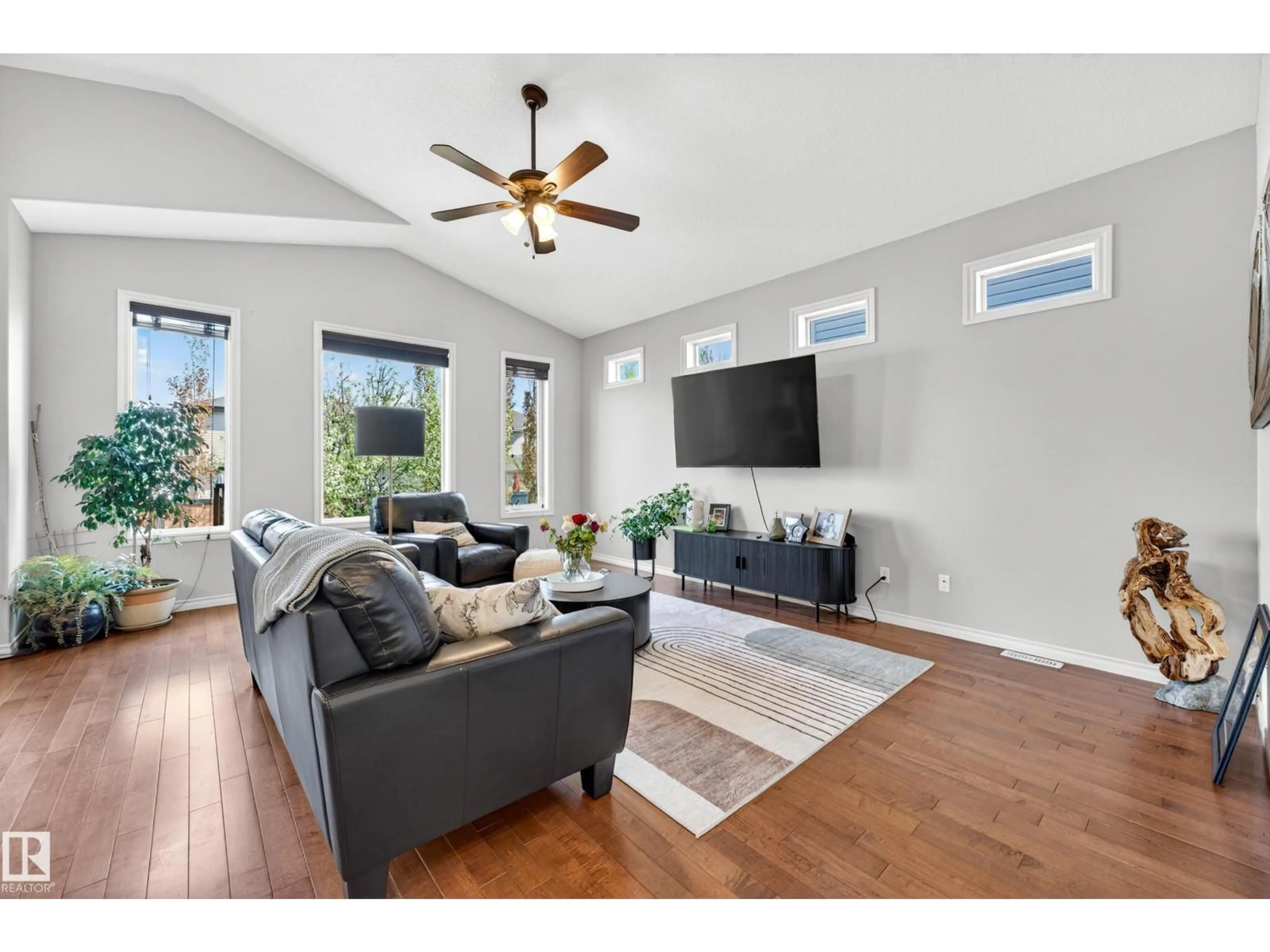 Living room with furniture, wood/laminate floor for 100 NAPOLEON CR, St. Albert Alberta T8N3L8