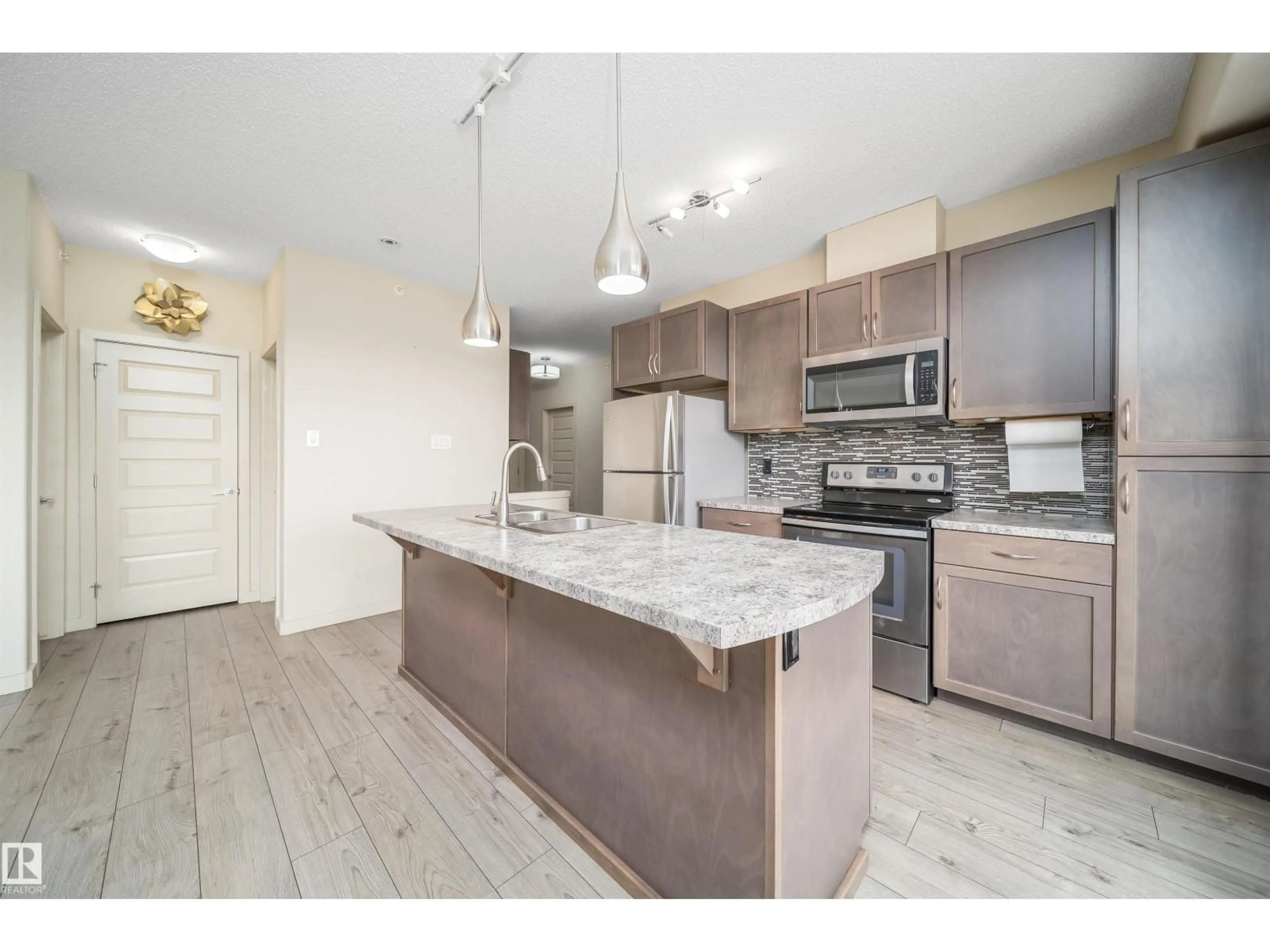 Open concept kitchen, unknown for #421 - 4008 SAVARYN DR, Edmonton Alberta T6X2E5