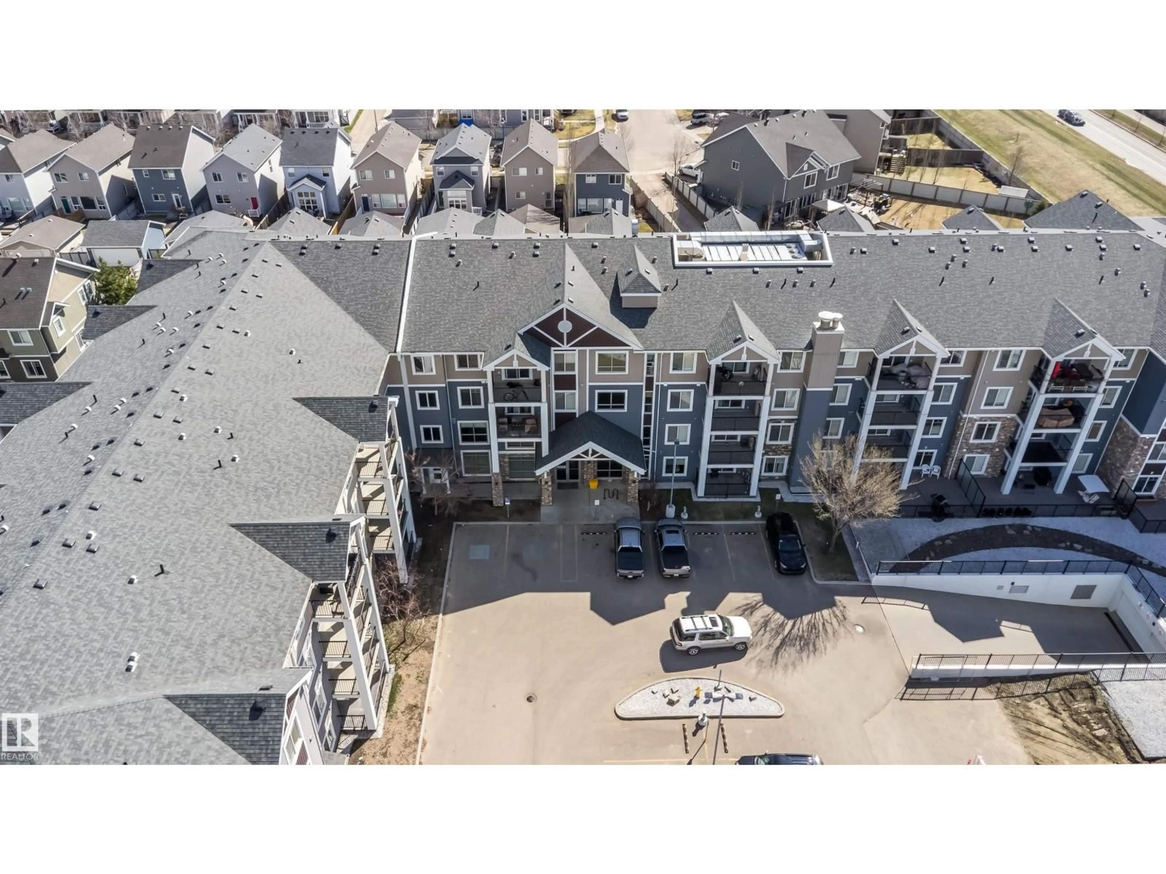 A pic from outside/outdoor area/front of a property/back of a property/a pic from drone, building for #421 - 4008 SAVARYN DR, Edmonton Alberta T6X2E5