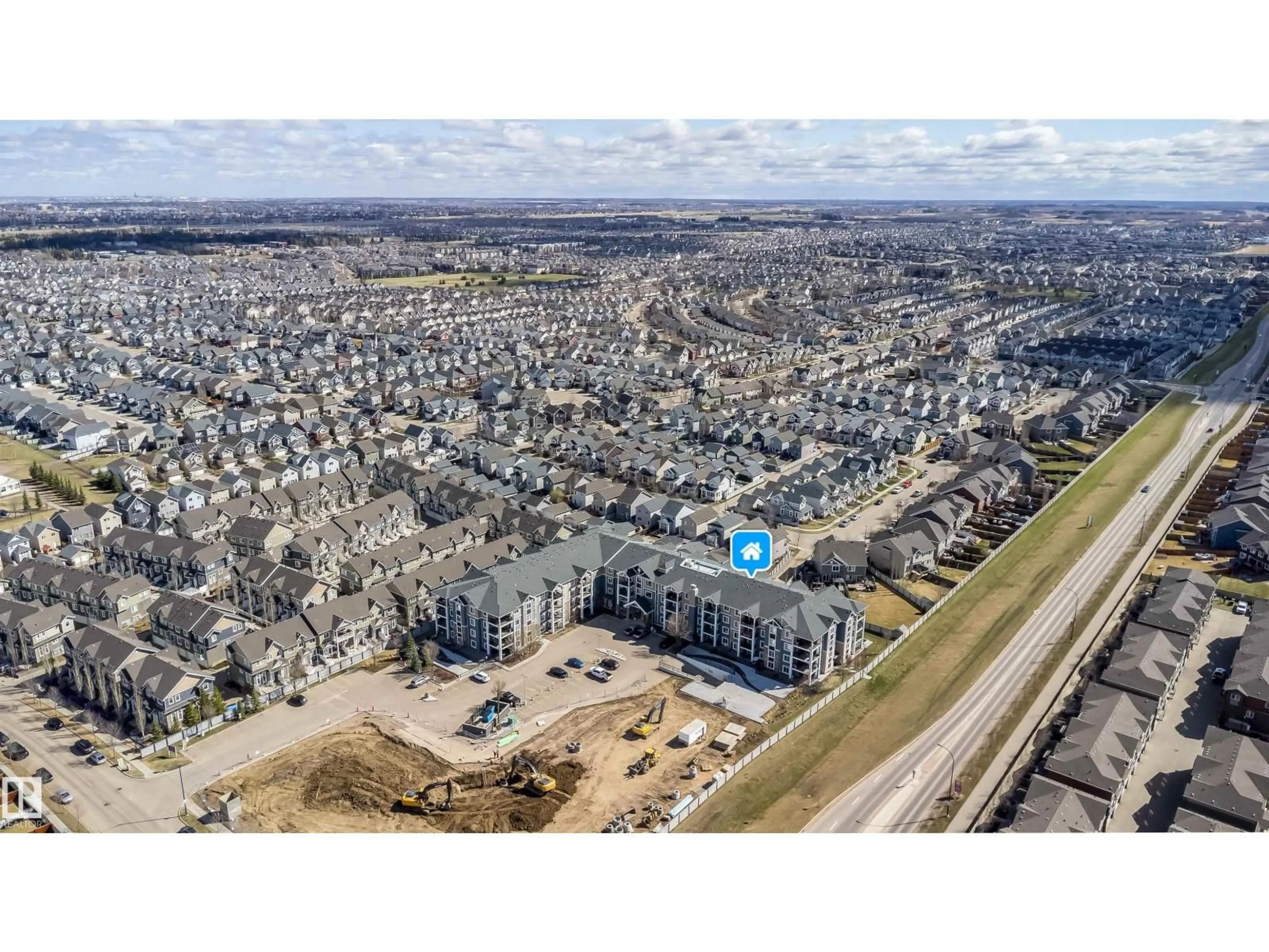 A pic from outside/outdoor area/front of a property/back of a property/a pic from drone, unknown for #421 - 4008 SAVARYN DR, Edmonton Alberta T6X2E5