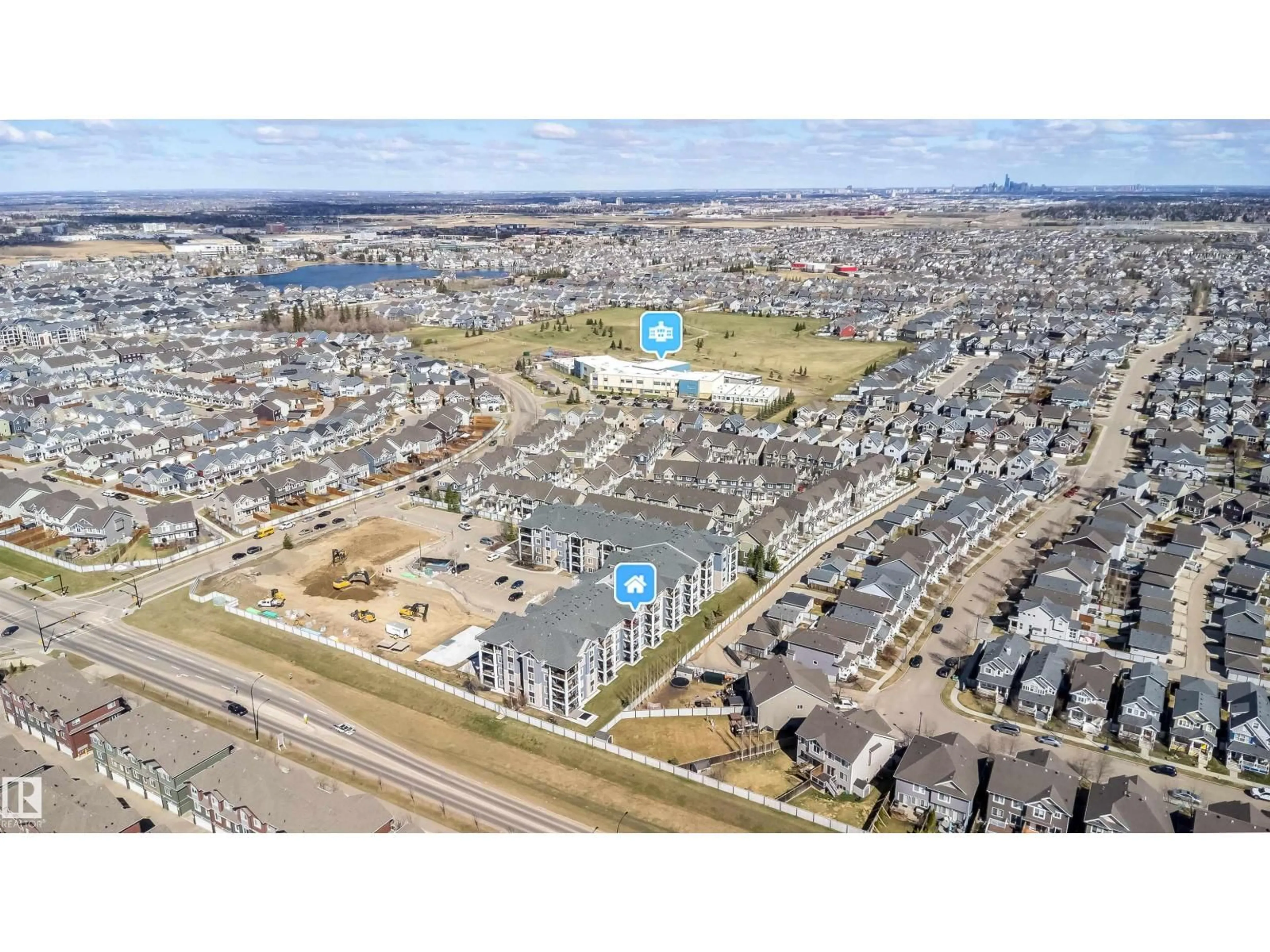 A pic from outside/outdoor area/front of a property/back of a property/a pic from drone, street for #421 - 4008 SAVARYN DR, Edmonton Alberta T6X2E5