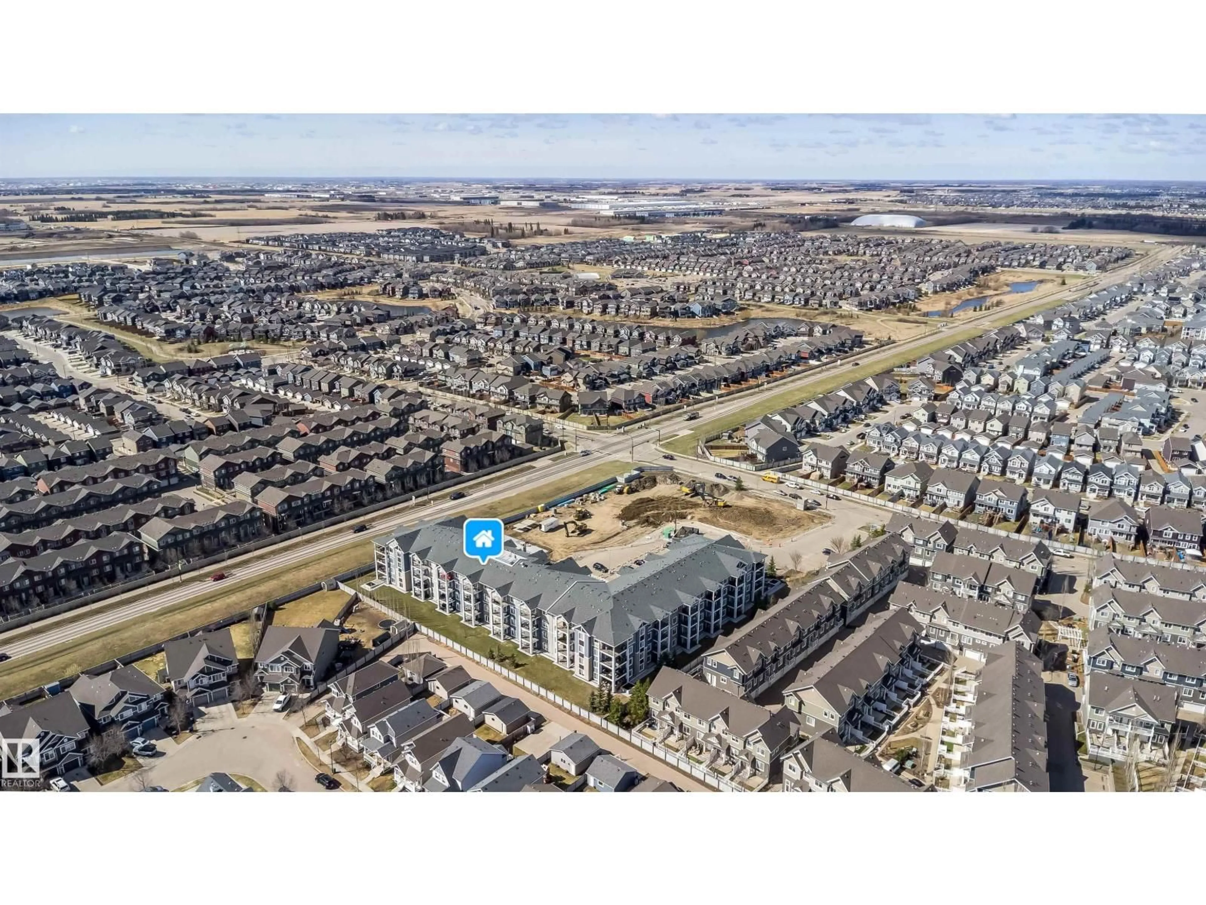 A pic from outside/outdoor area/front of a property/back of a property/a pic from drone, street for #421 - 4008 SAVARYN DR, Edmonton Alberta T6X2E5