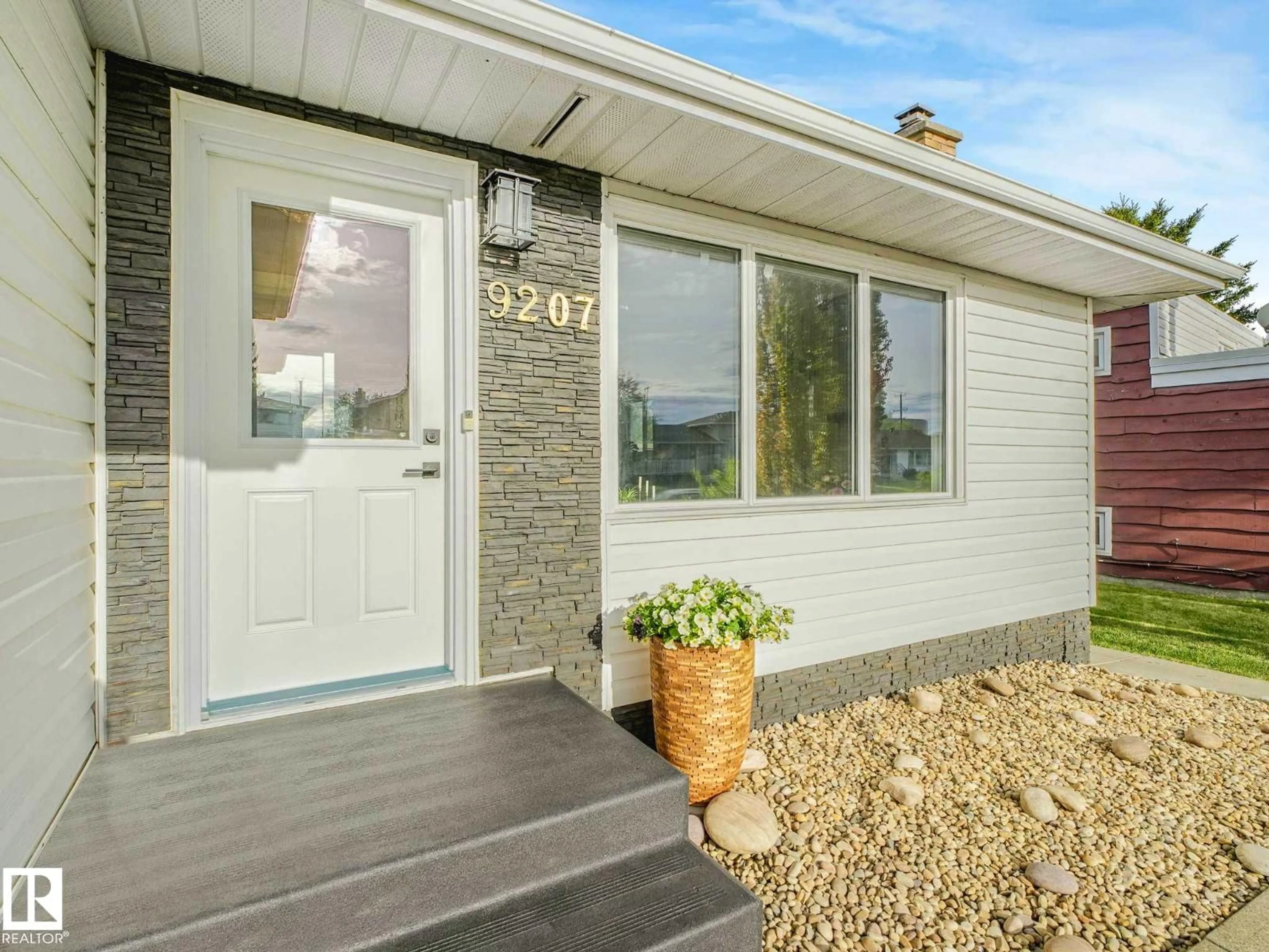 Home with vinyl exterior material, street for 9207 169 ST, Edmonton Alberta T5R2X3
