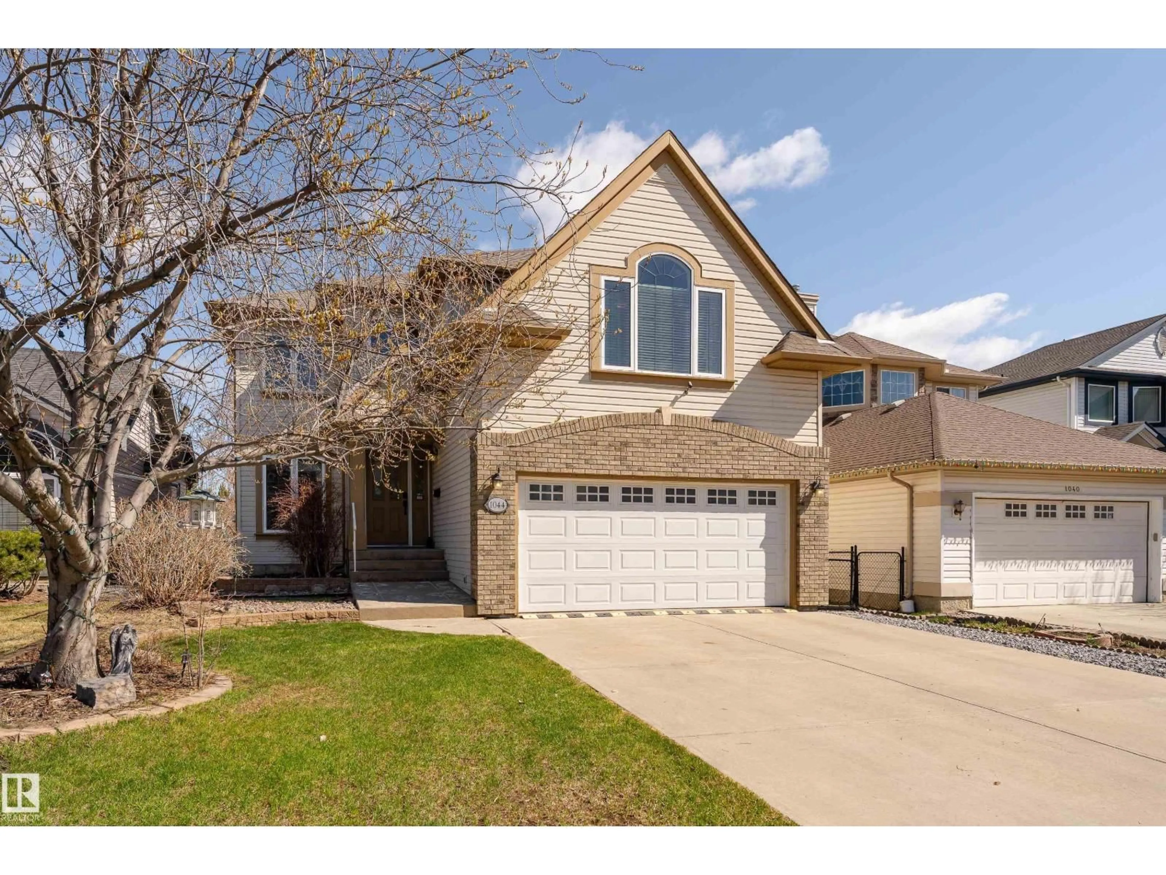Home with vinyl exterior material, street for 1044 BARNES WY, Edmonton Alberta T6W1E4