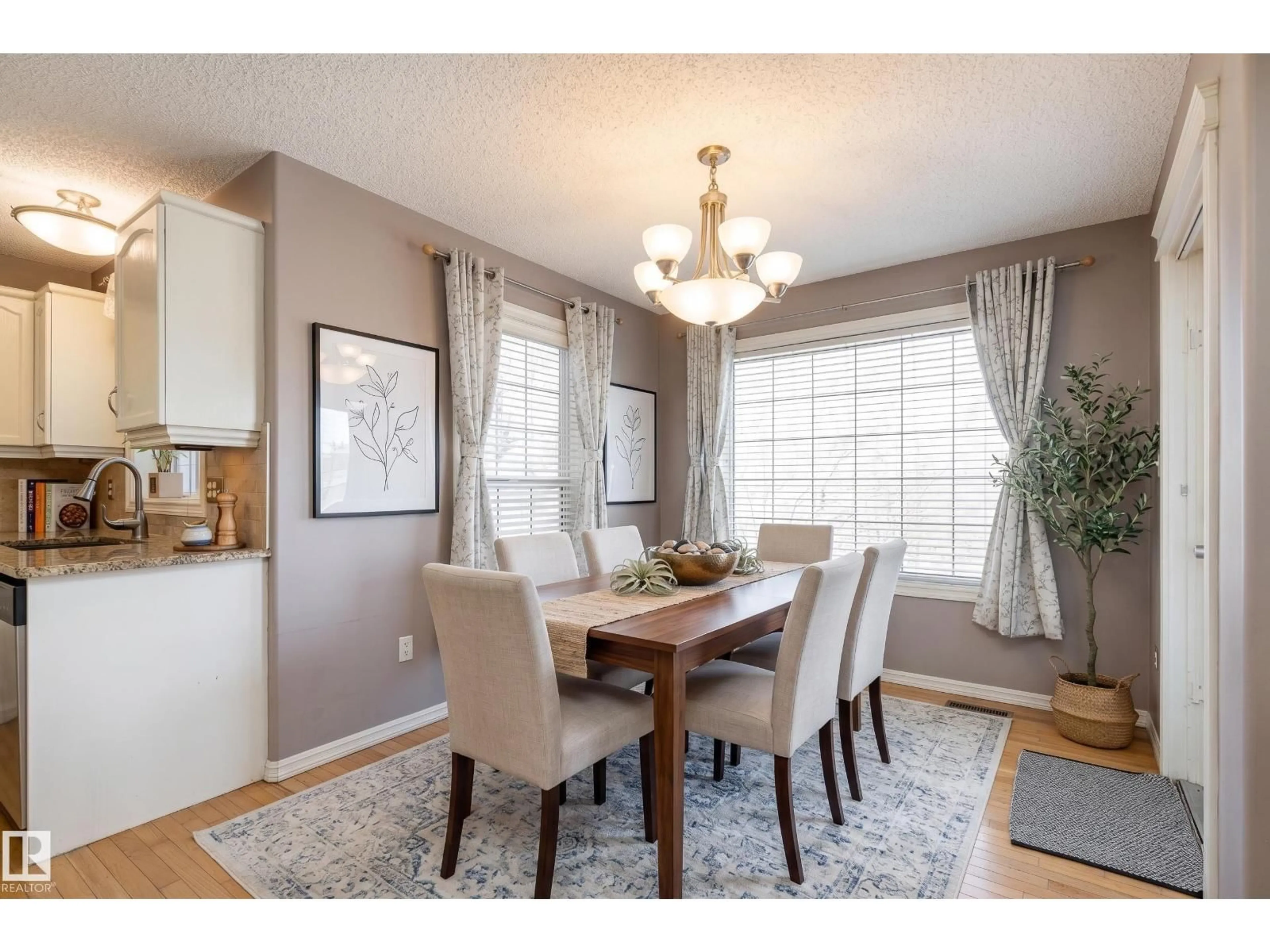 Dining room, wood/laminate floor for 1044 BARNES WY, Edmonton Alberta T6W1E4