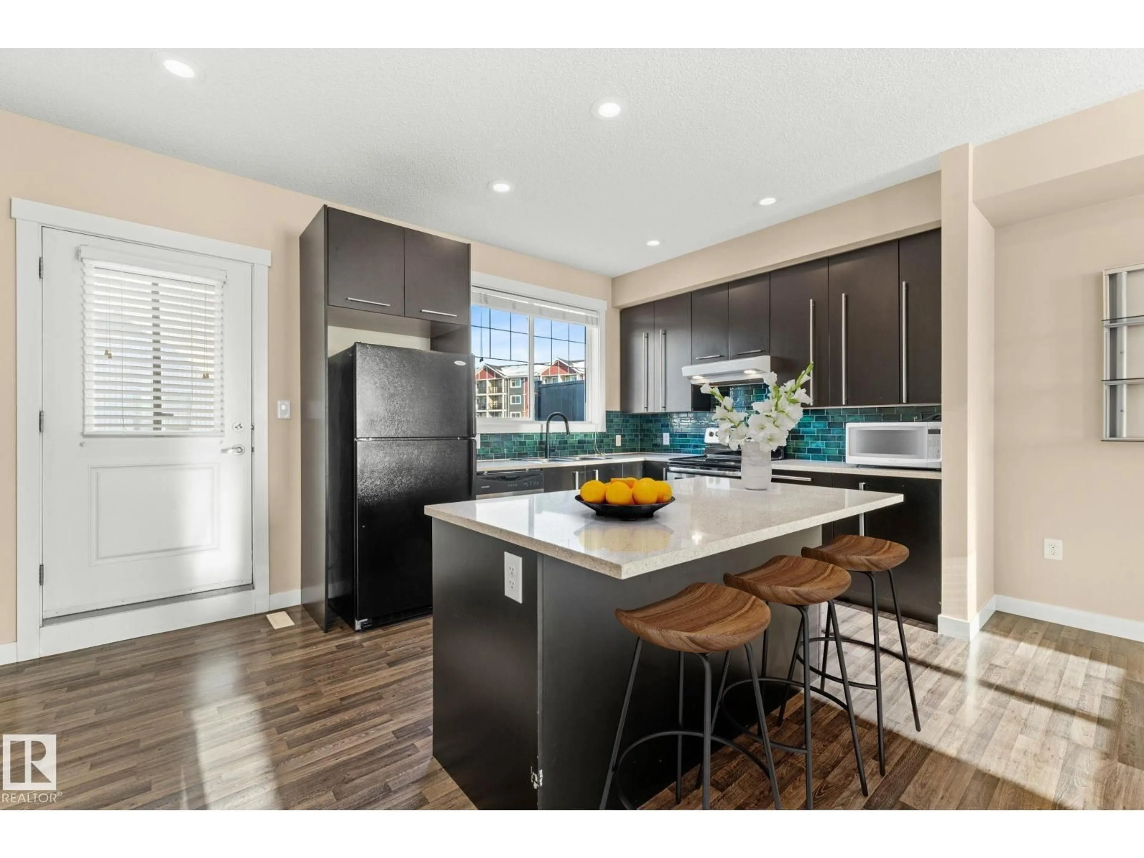 Open concept kitchen, unknown for #30 - 8315 180 AV, Edmonton Alberta T5Z0J2