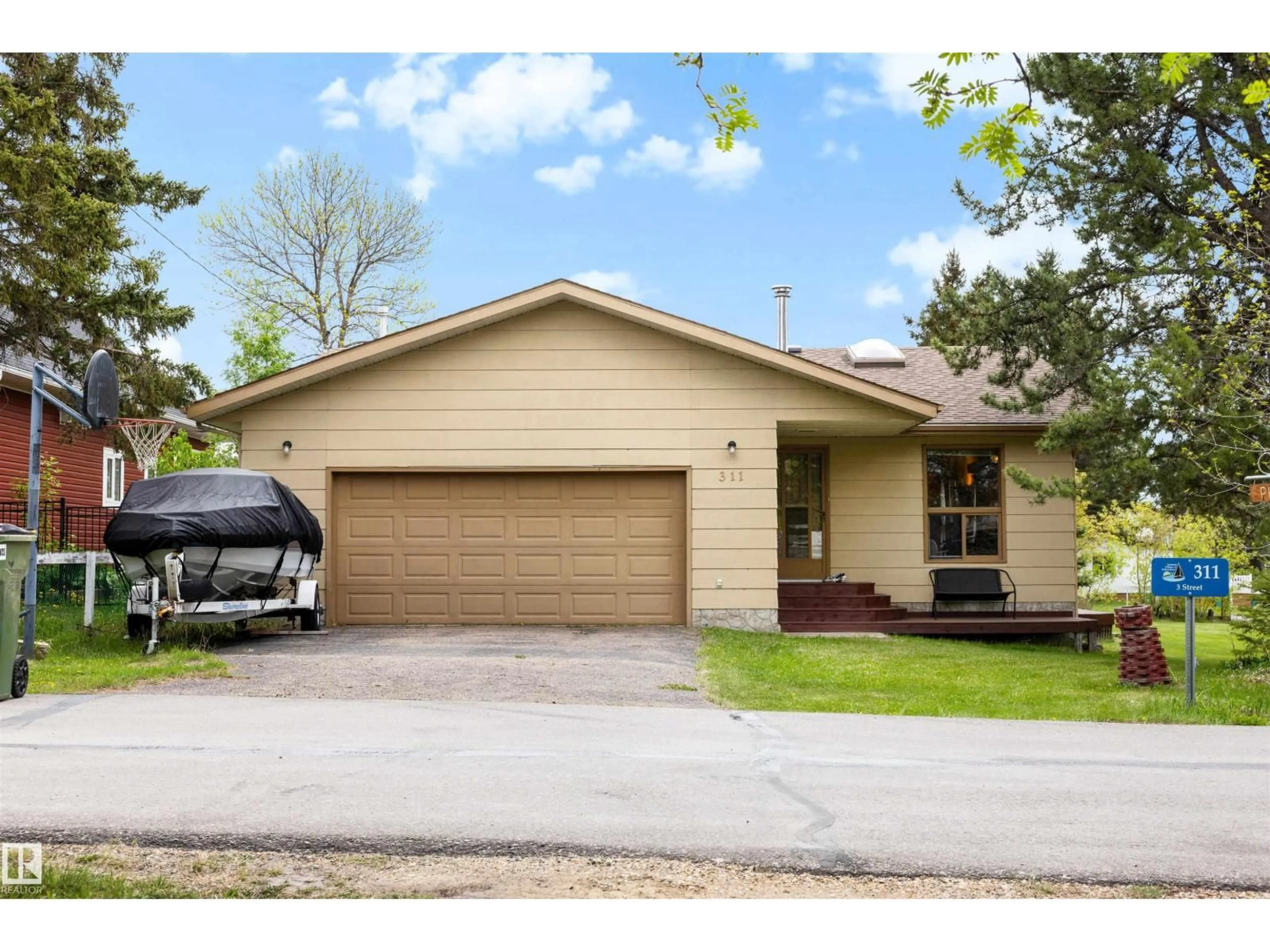 Home with vinyl exterior material, street for 311 3 ST, Rural Lac Ste. Anne County Alberta T0E1A0
