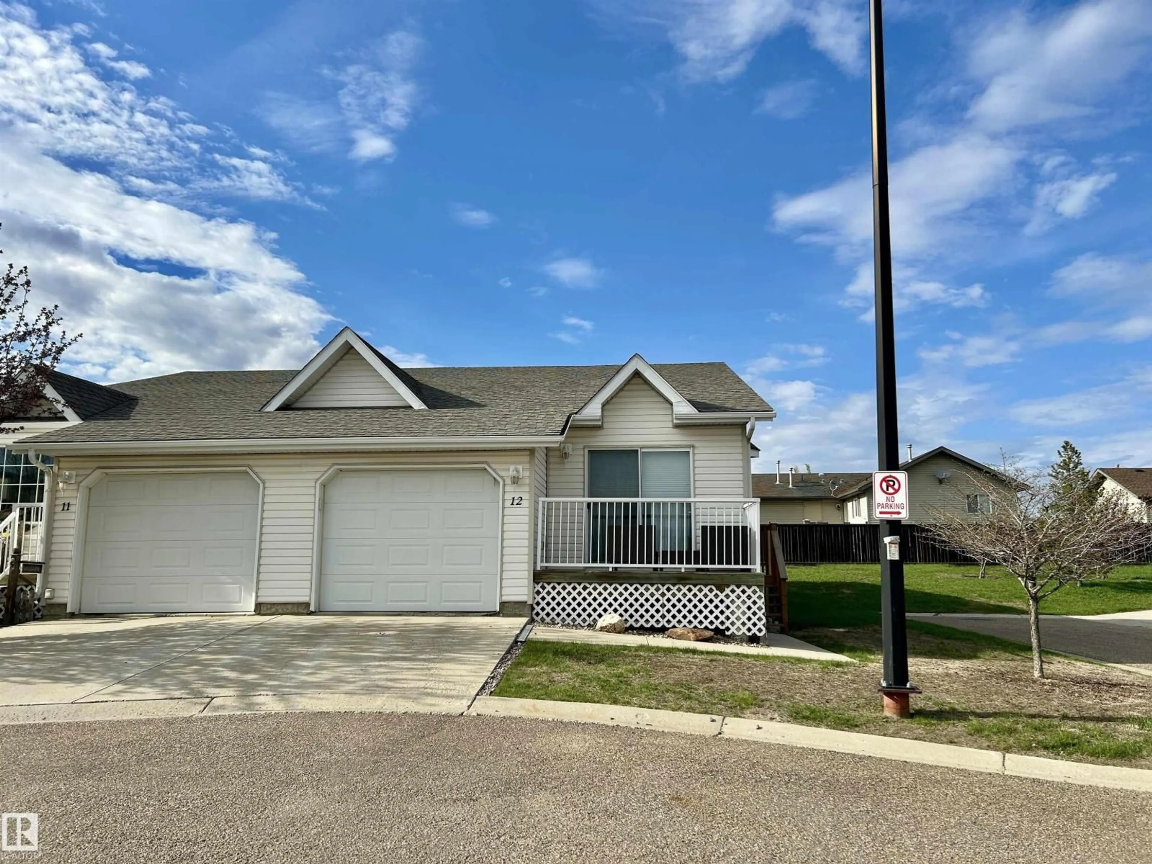 Home with vinyl exterior material, street for 12 5104 18 ST, Lloydminster Alberta T9V0A8