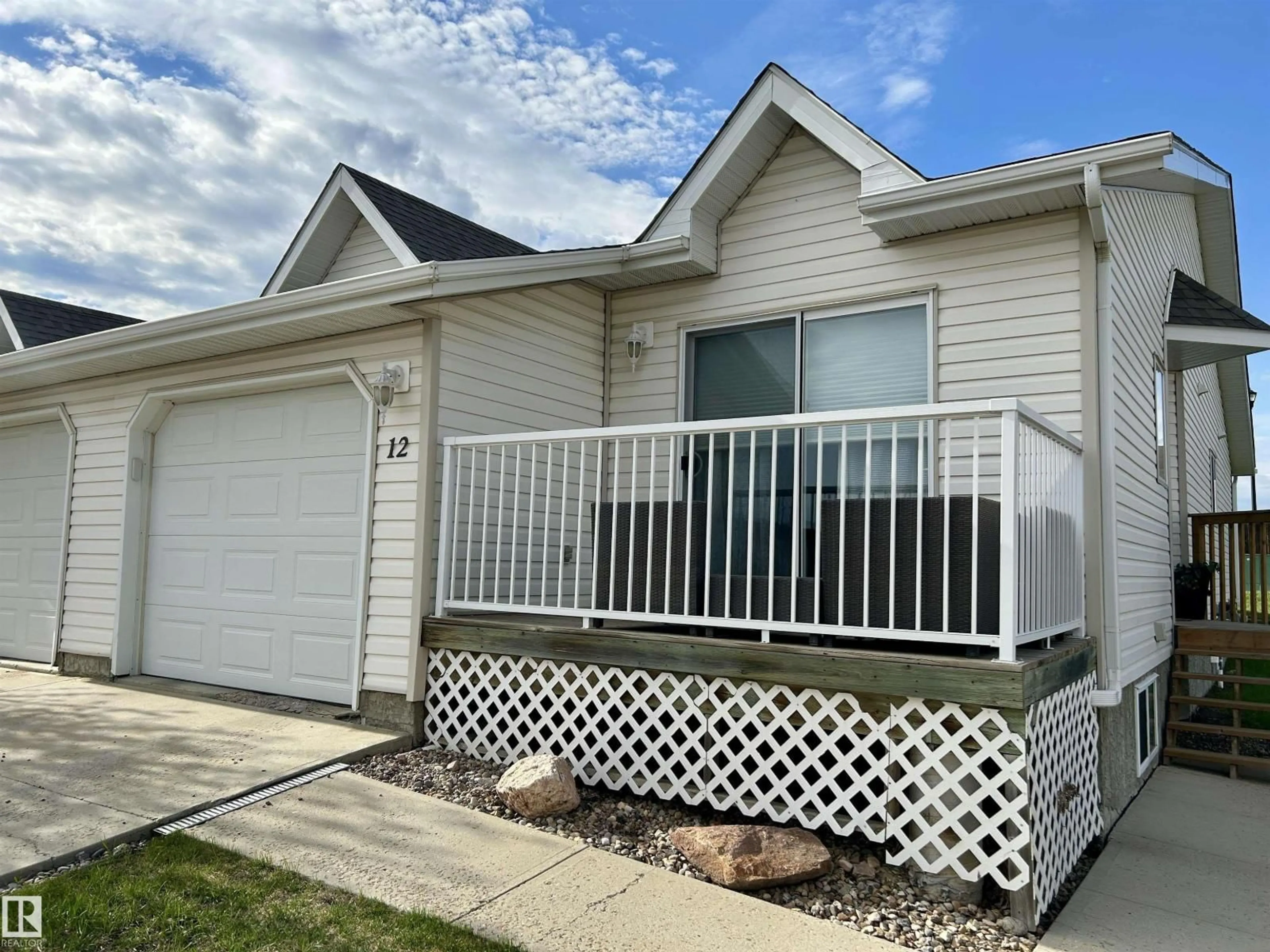 Home with vinyl exterior material, street for 12 5104 18 ST, Lloydminster Alberta T9V0A8