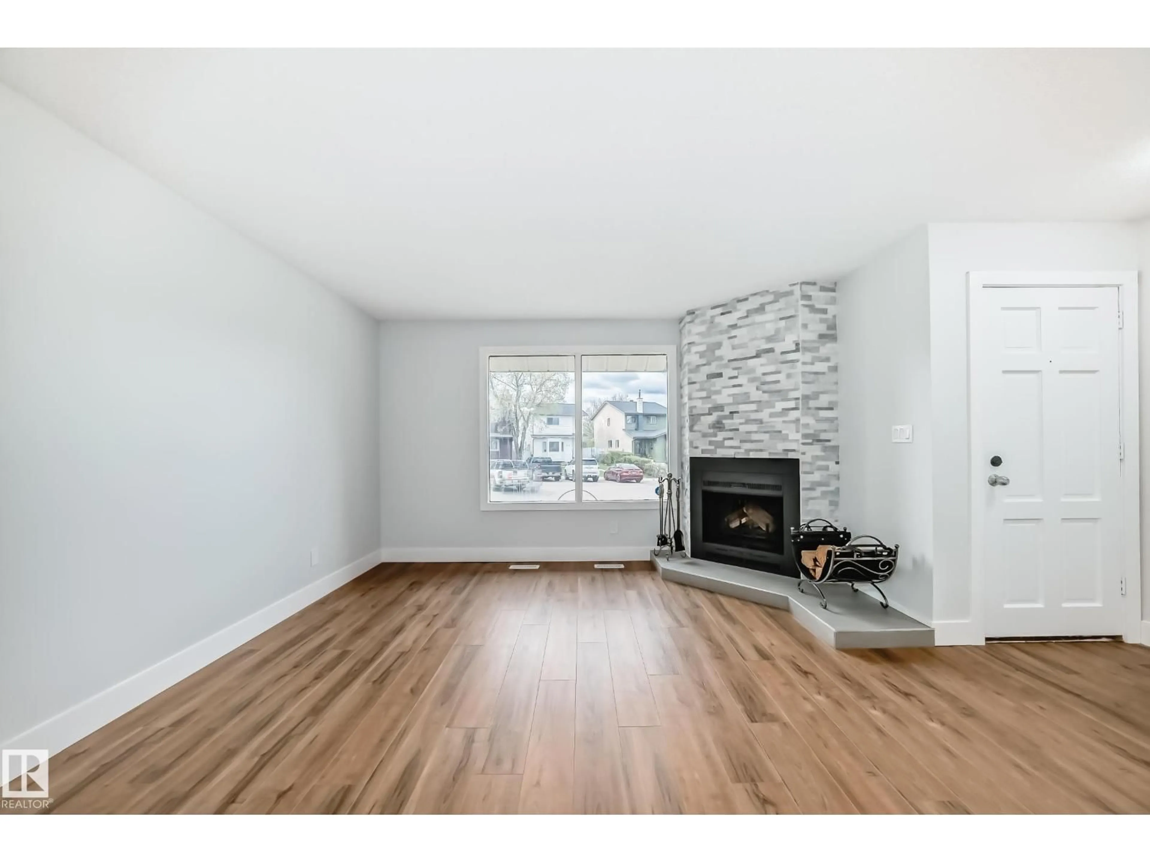 Living room with furniture, wood/laminate floor for NW - 3510 41B AV, Edmonton Alberta T6L5E6