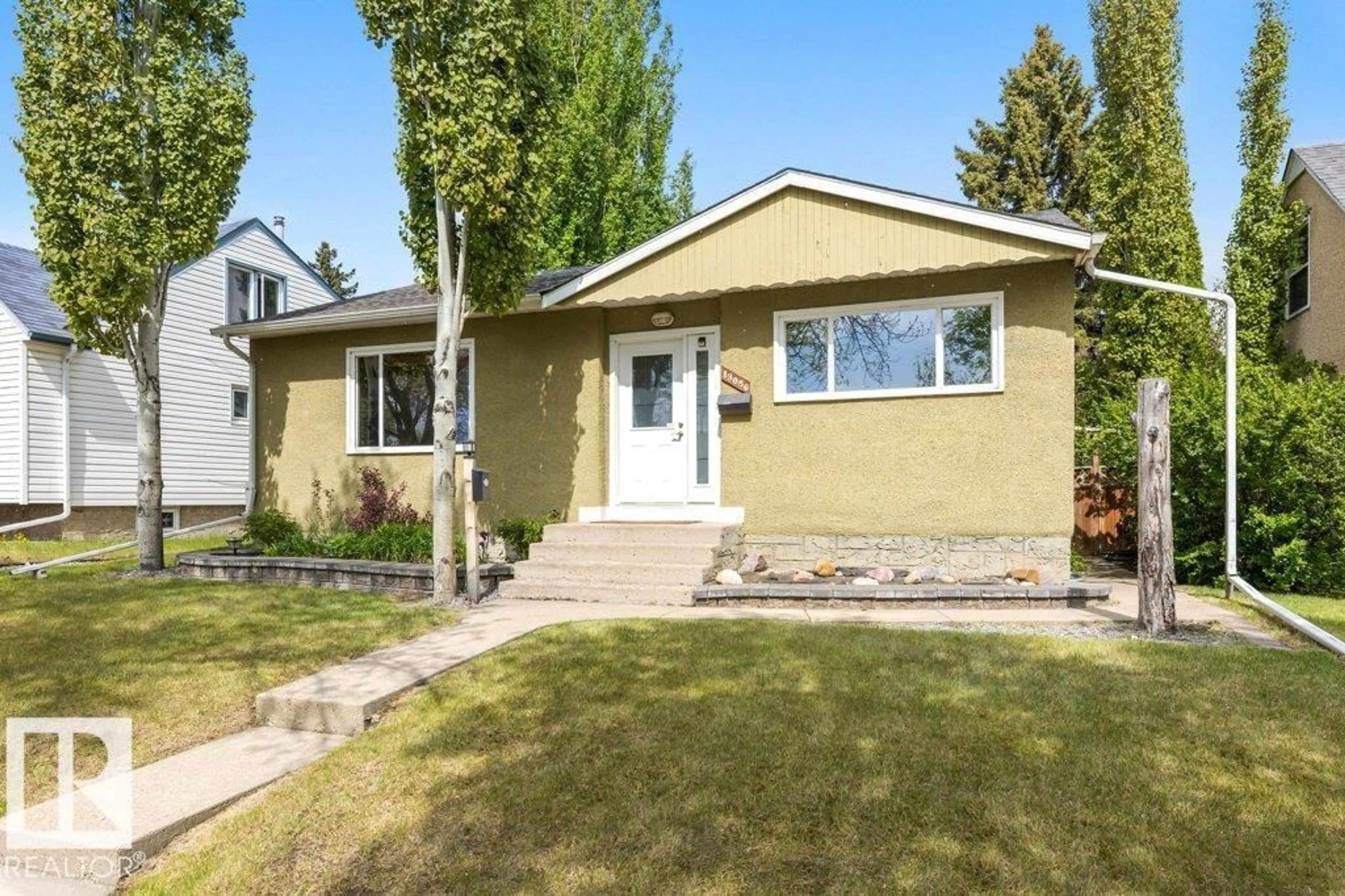 Home with vinyl exterior material, street for 13056 SHERBROOKE AV, Edmonton Alberta T5L4E9