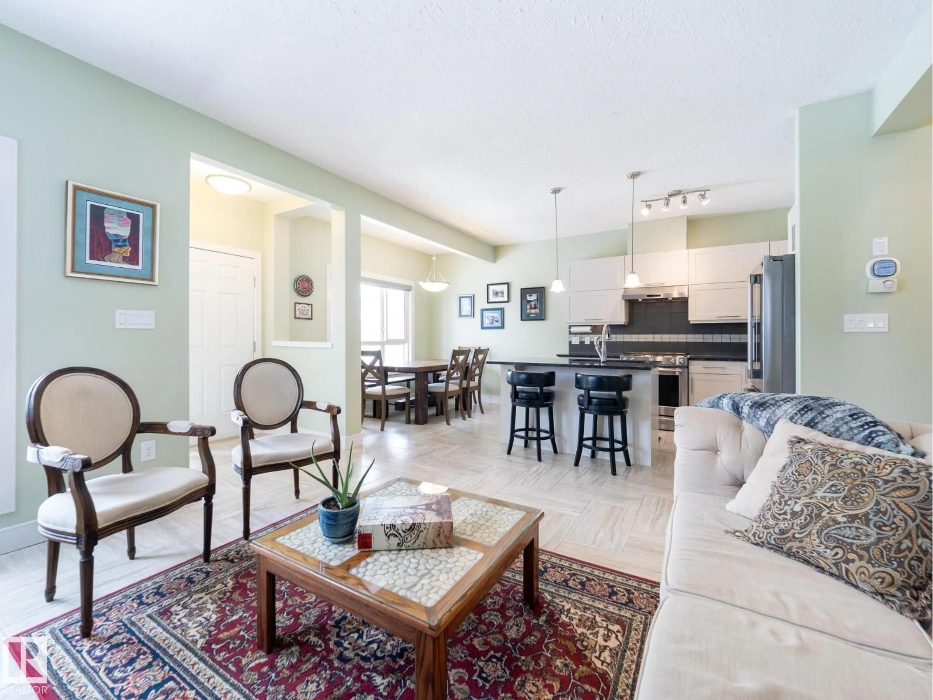 Living room with furniture, ceramic/tile floor for 13035 132 AV, Edmonton Alberta T5L3R2