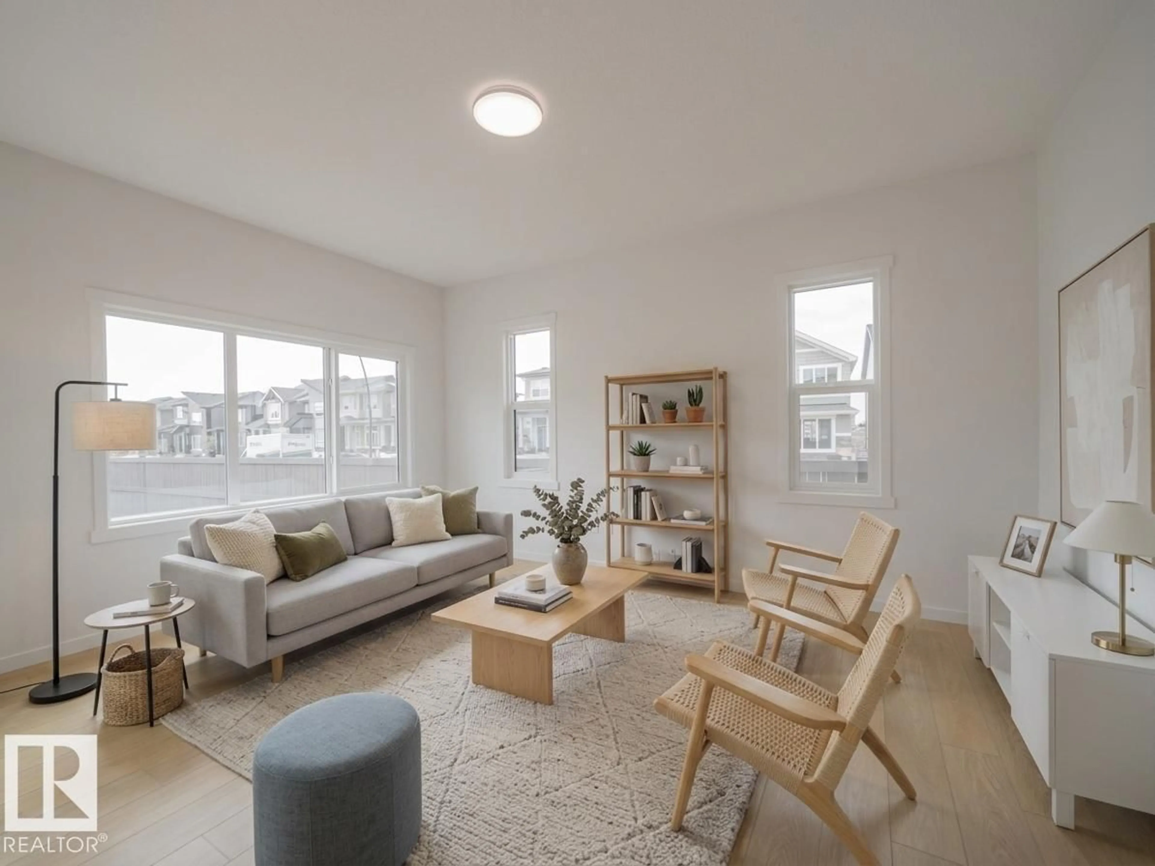 Living room with furniture, wood/laminate floor for NW - 2503 211 ST, Edmonton Alberta T6M3H1