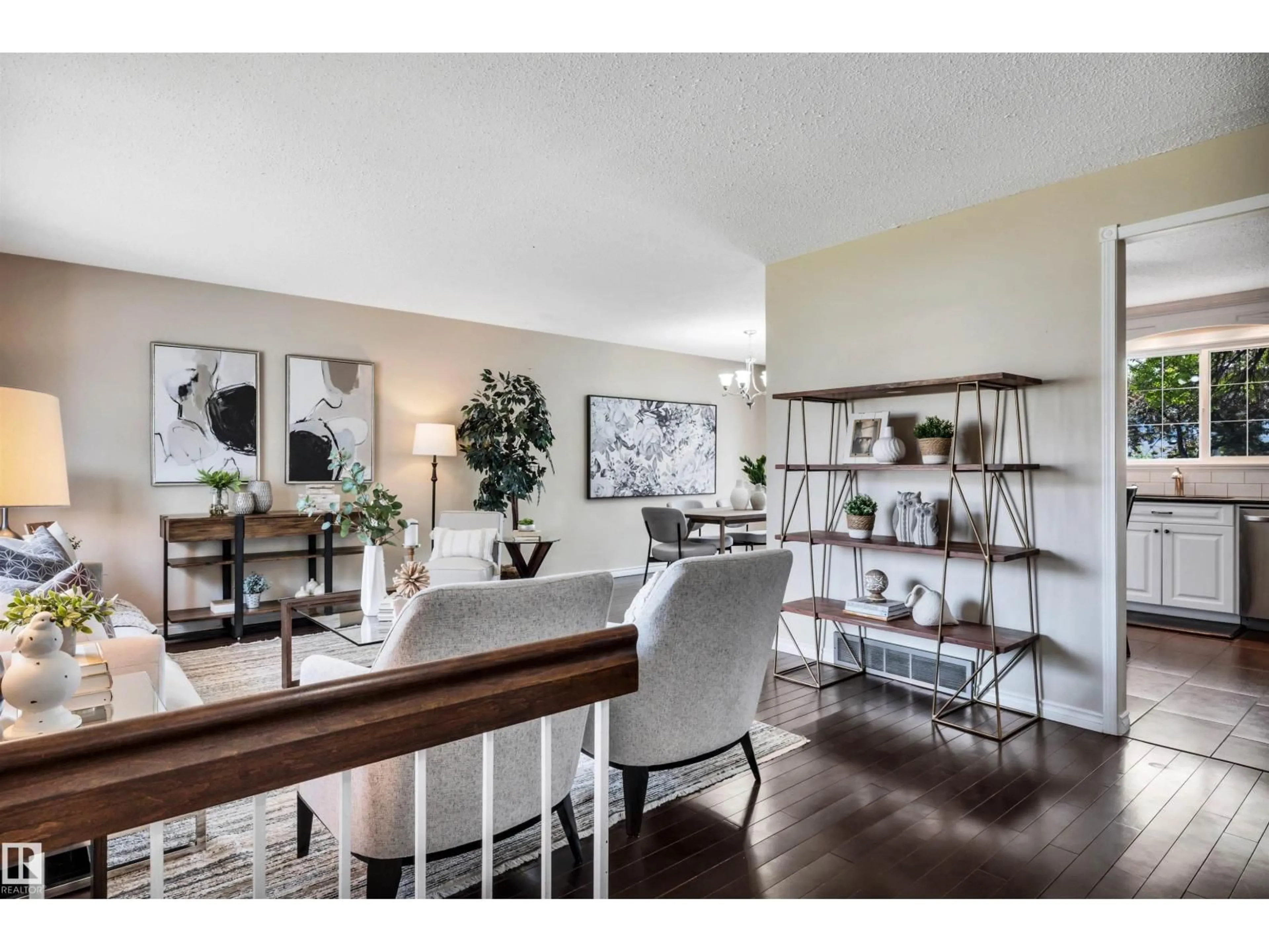 Living room with furniture, wood/laminate floor for 10909 33A AV, Edmonton Alberta T6J3C6
