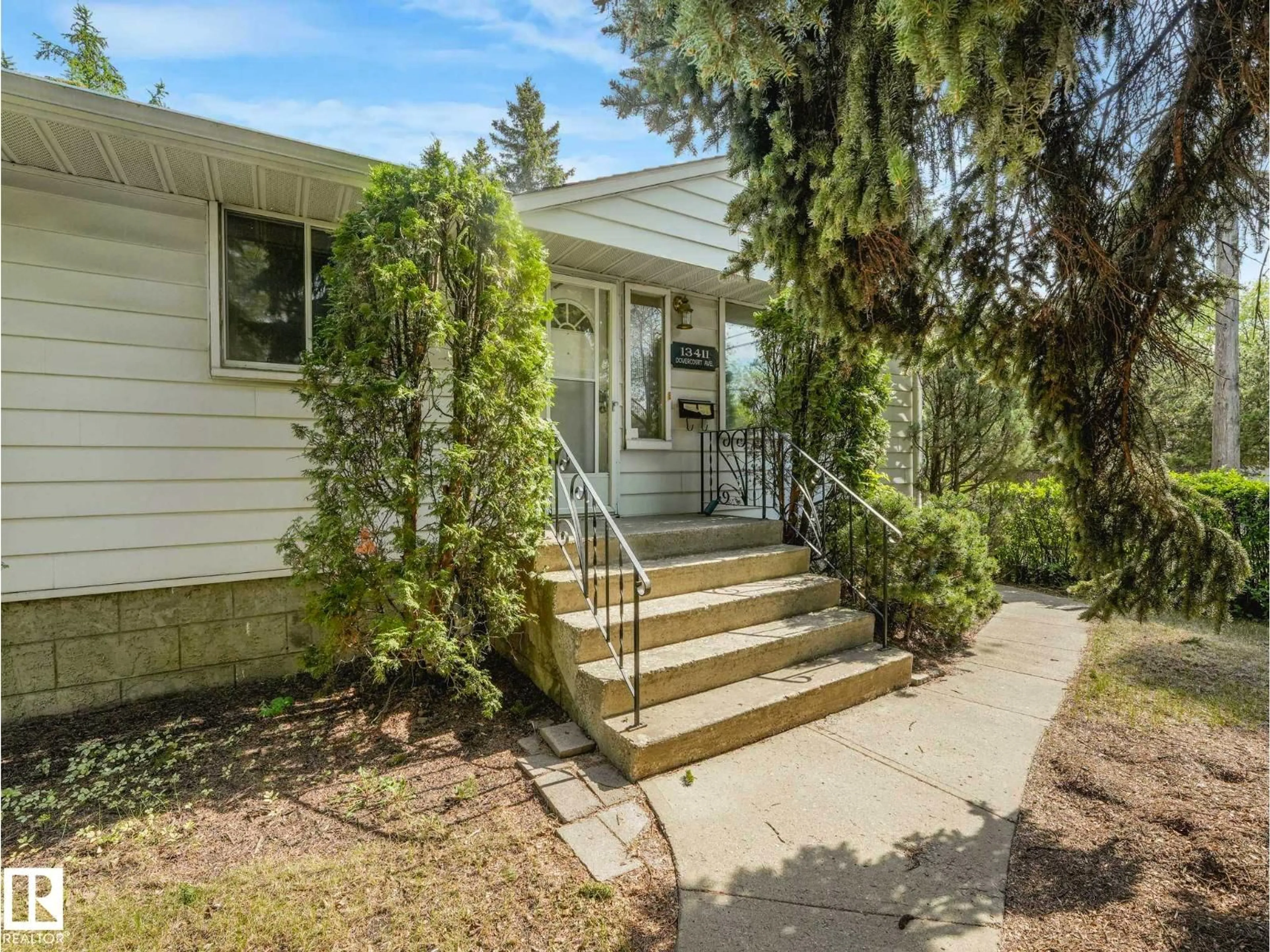 Home with vinyl exterior material, street for 13411 DOVERCOURT AV, Edmonton Alberta T5L4E3