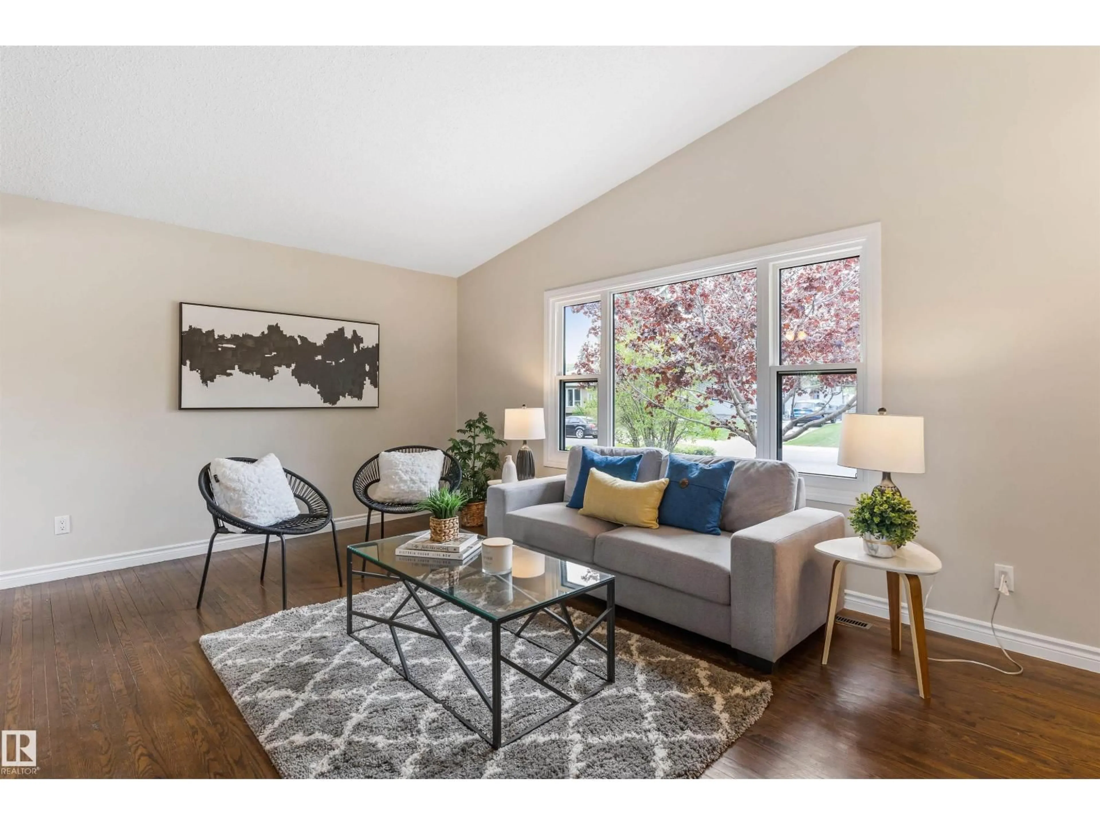 Living room with furniture, wood/laminate floor for NW - 8715 164A ST, Edmonton Alberta T5R2R2