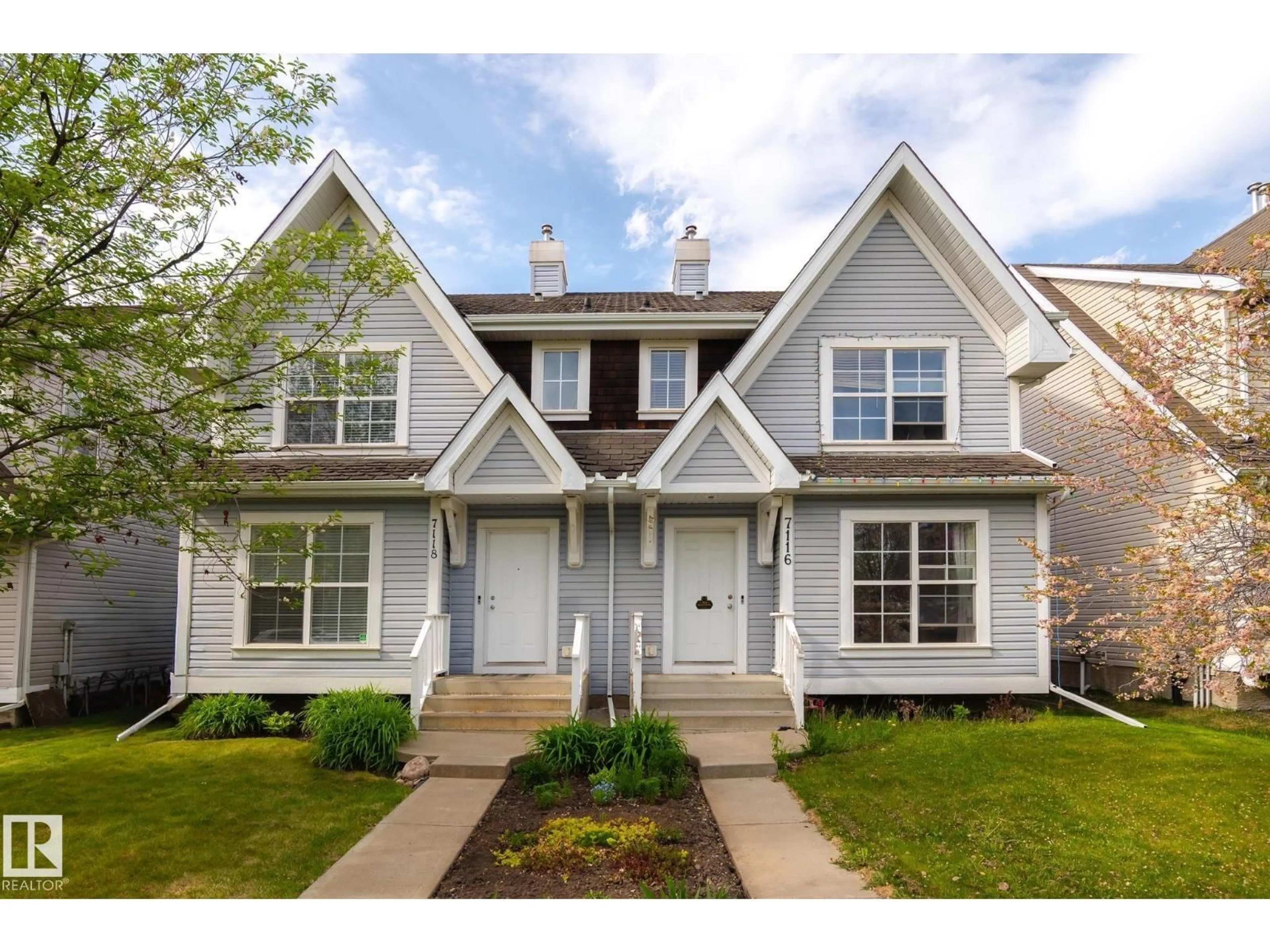 Home with vinyl exterior material, street for 7118 19A SW, Edmonton Alberta T6X0K2
