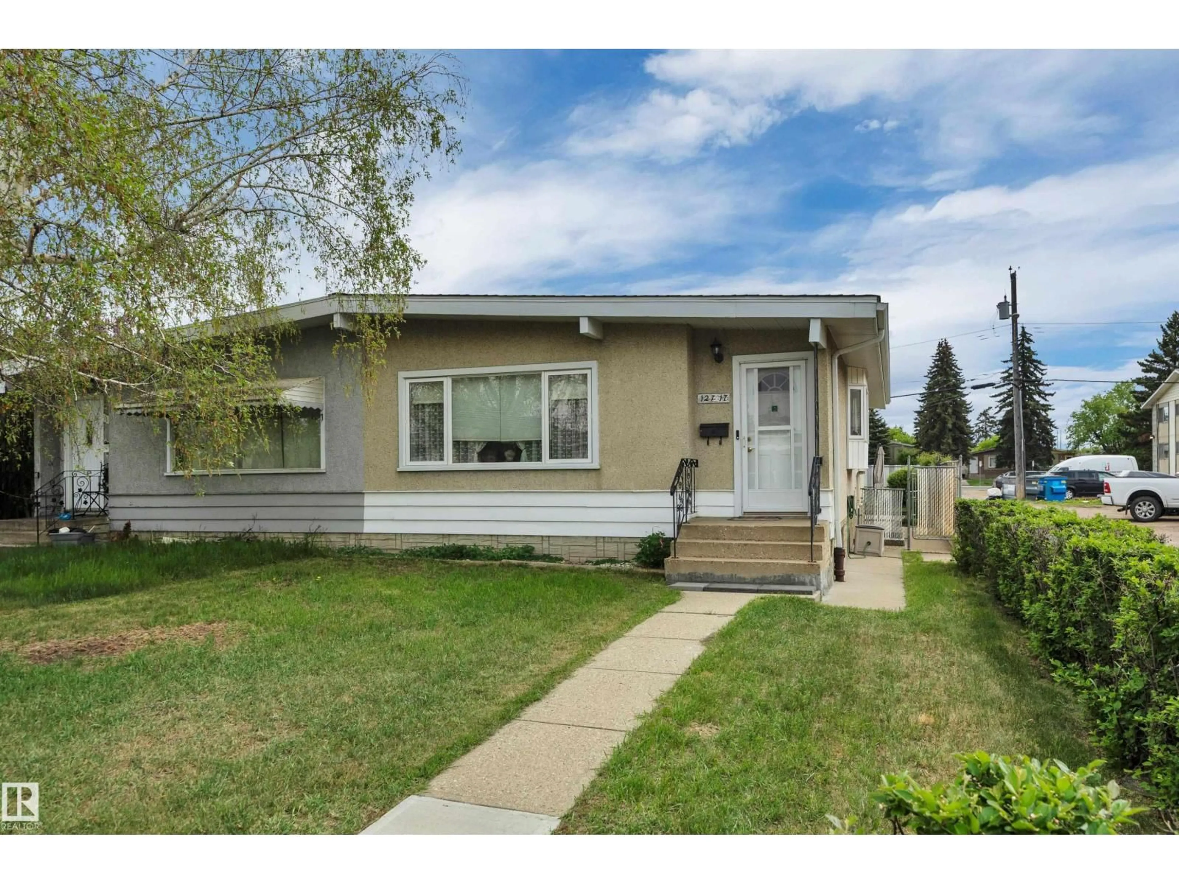Home with vinyl exterior material, street for NW - 12717 91 ST, Edmonton Alberta T5E3P2